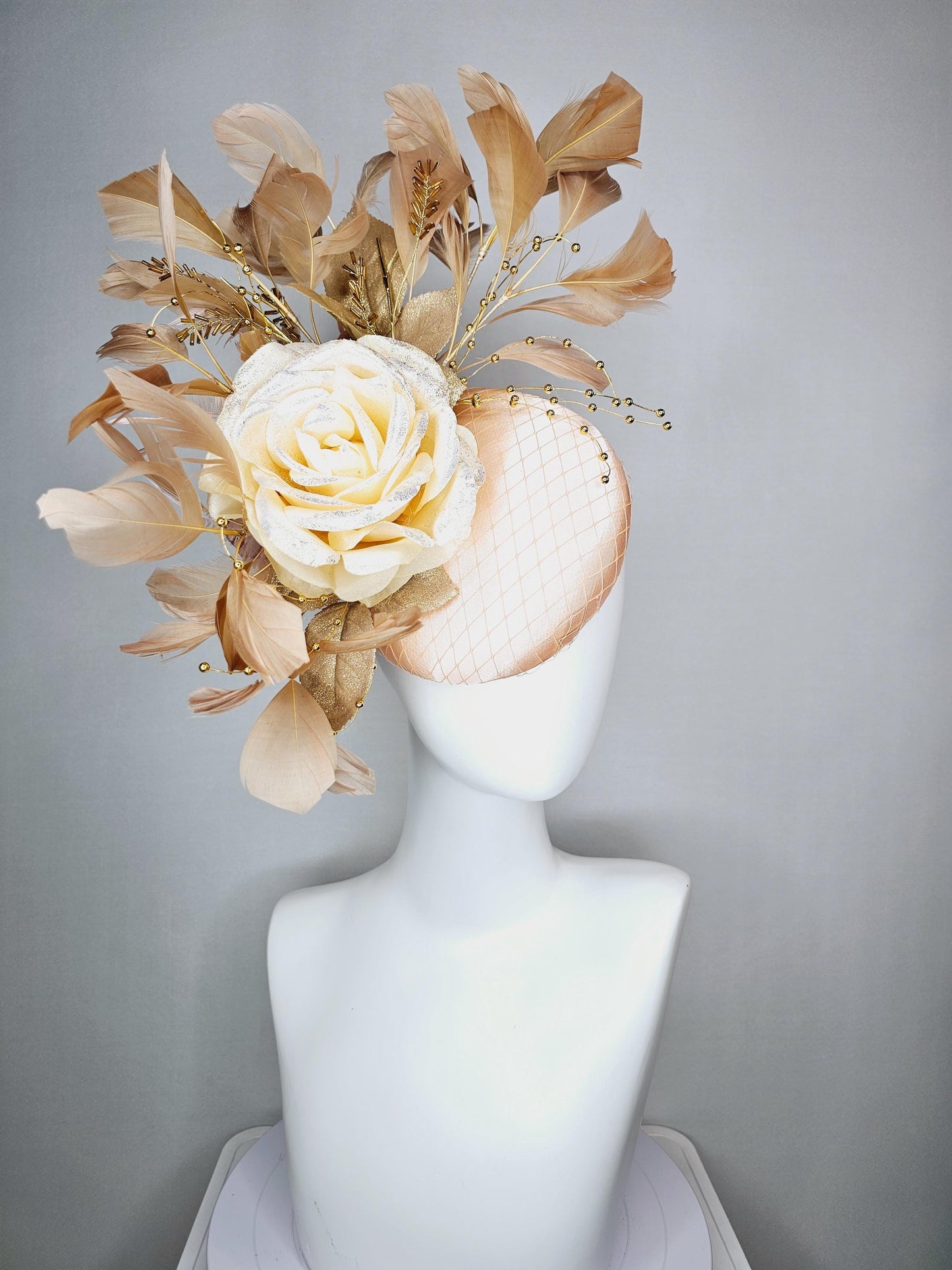 kentucky derby hat fascinator champagne pink satin with netting neutral cream satin rose flower gold leaves tan beige branching feathers
