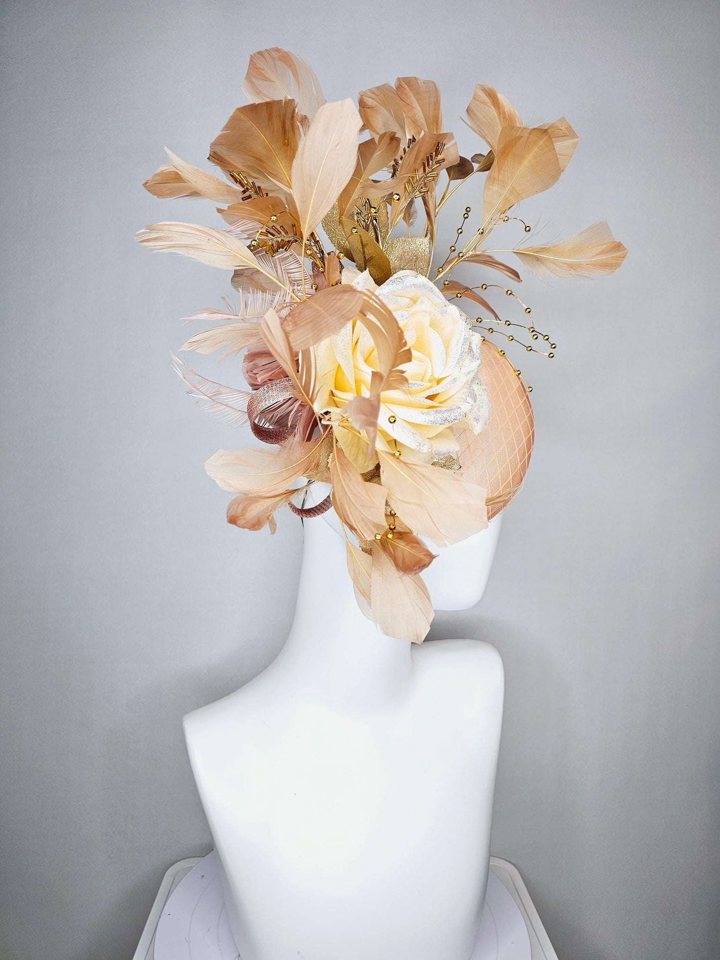 kentucky derby hat fascinator champagne pink satin with netting neutral cream satin rose flower gold leaves tan beige branching feathers