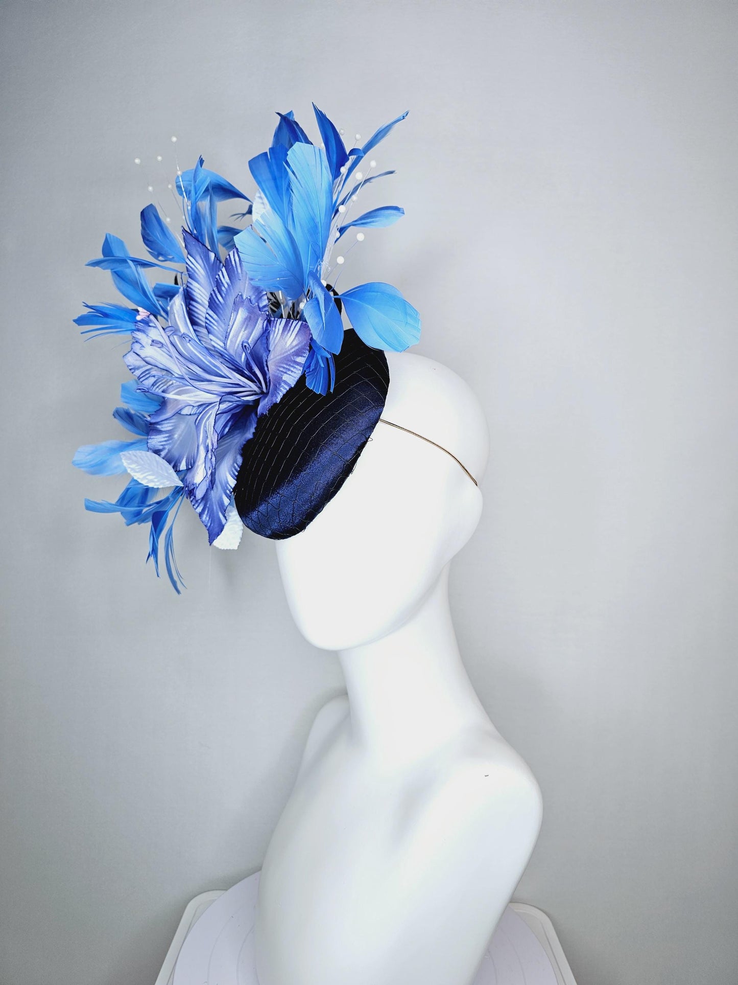 kentucky derby hat fascinator navy blue satin with netting large ombre blue satin flower white leaves navy blue sky blue branching feathers