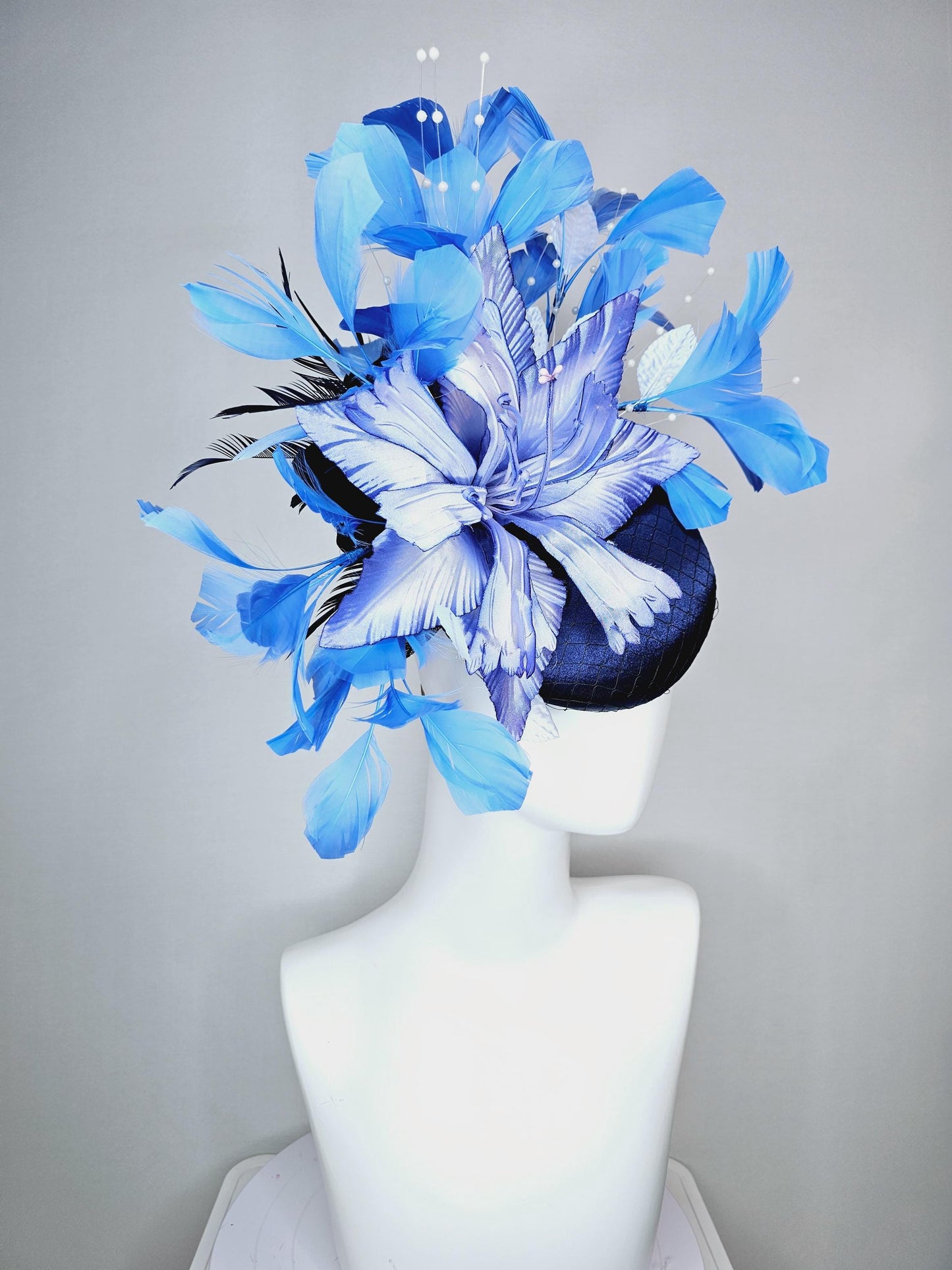 kentucky derby hat fascinator navy blue satin with netting large ombre blue satin flower white leaves navy blue sky blue branching feathers