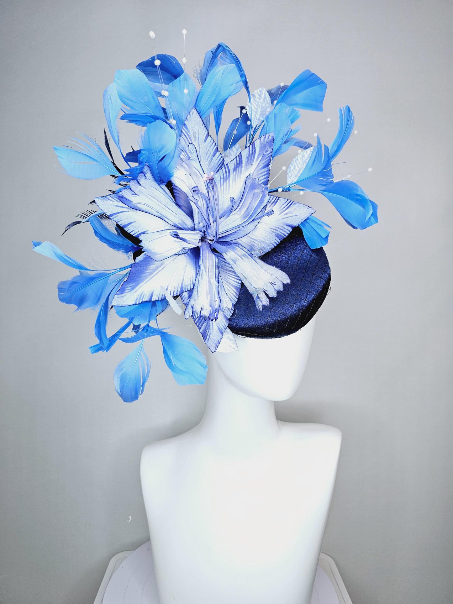 kentucky derby hat fascinator navy blue satin with netting large ombre blue satin flower white leaves navy blue sky blue branching feathers