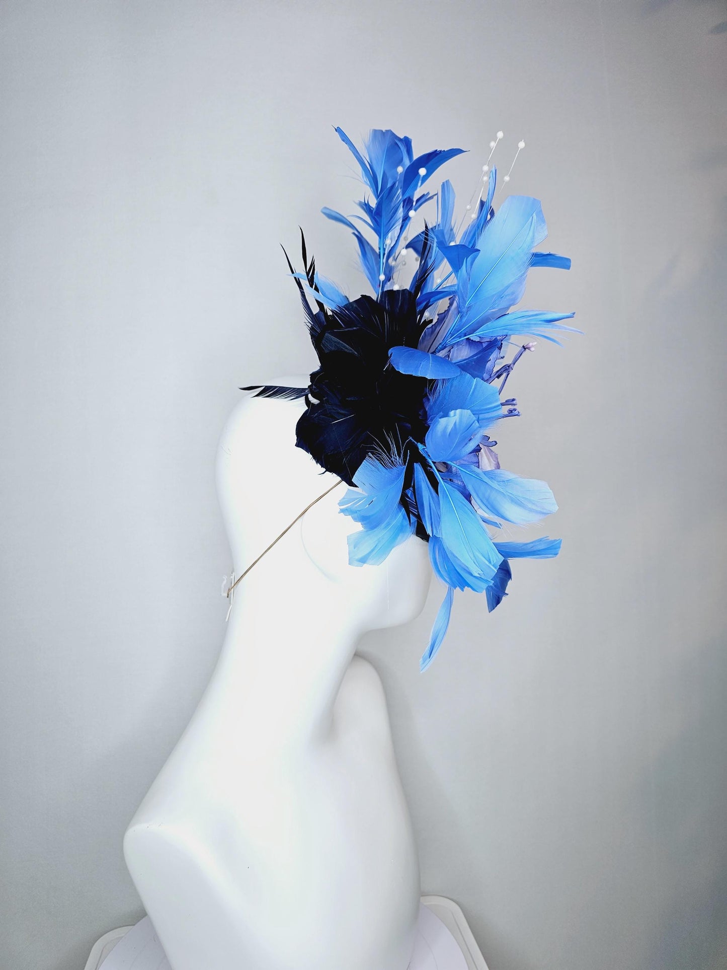 kentucky derby hat fascinator navy blue satin with netting large ombre blue satin flower white leaves navy blue sky blue branching feathers