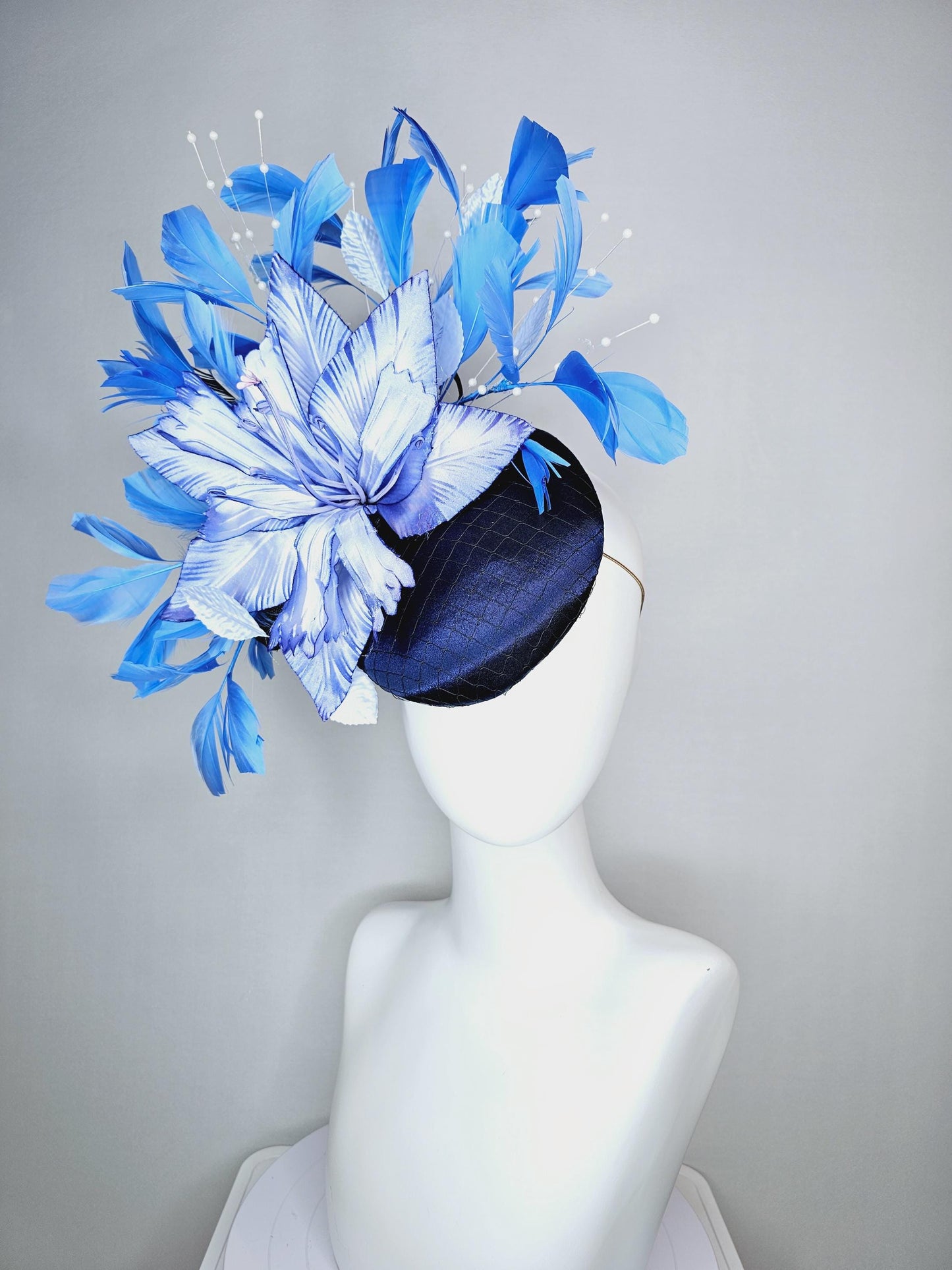 kentucky derby hat fascinator navy blue satin with netting large ombre blue satin flower white leaves navy blue sky blue branching feathers