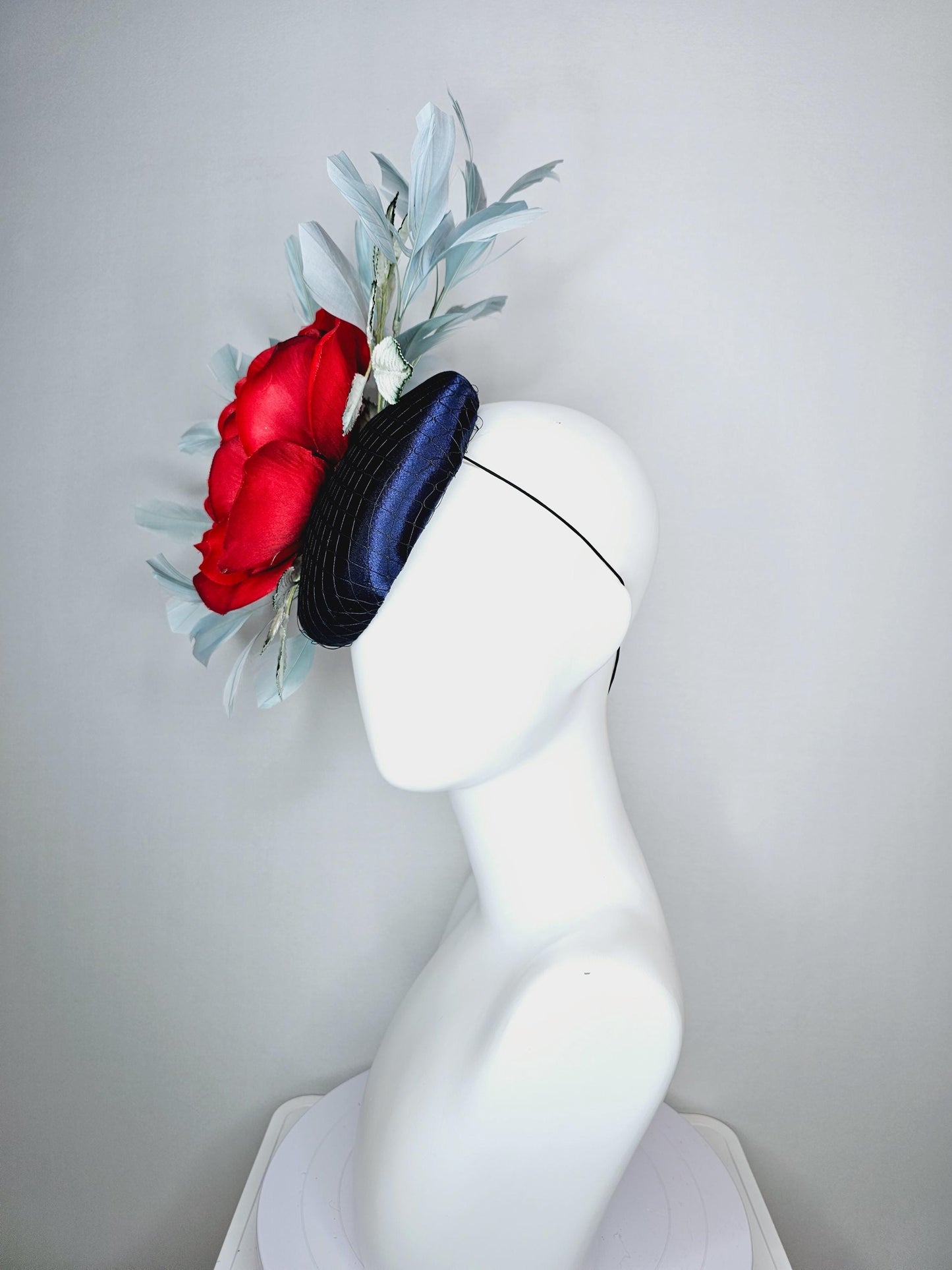 kentucky derby hat fascinator navy blue satin with netting red satin rose flower ombre green leaves with light teal blue branching feathers