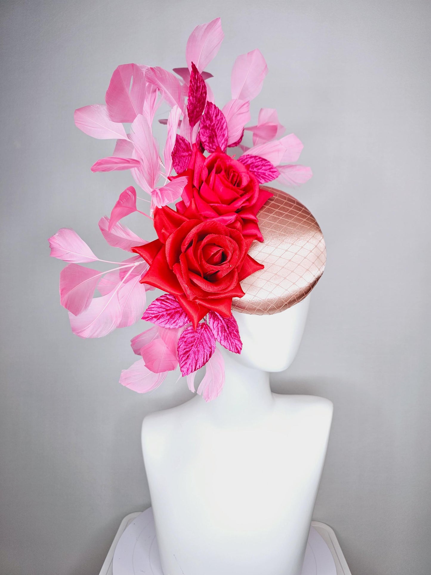 kentucky derby hat fascinator champagne pink satin with netting red satin rose flowers pink leaves and baby blush pink branching feathers