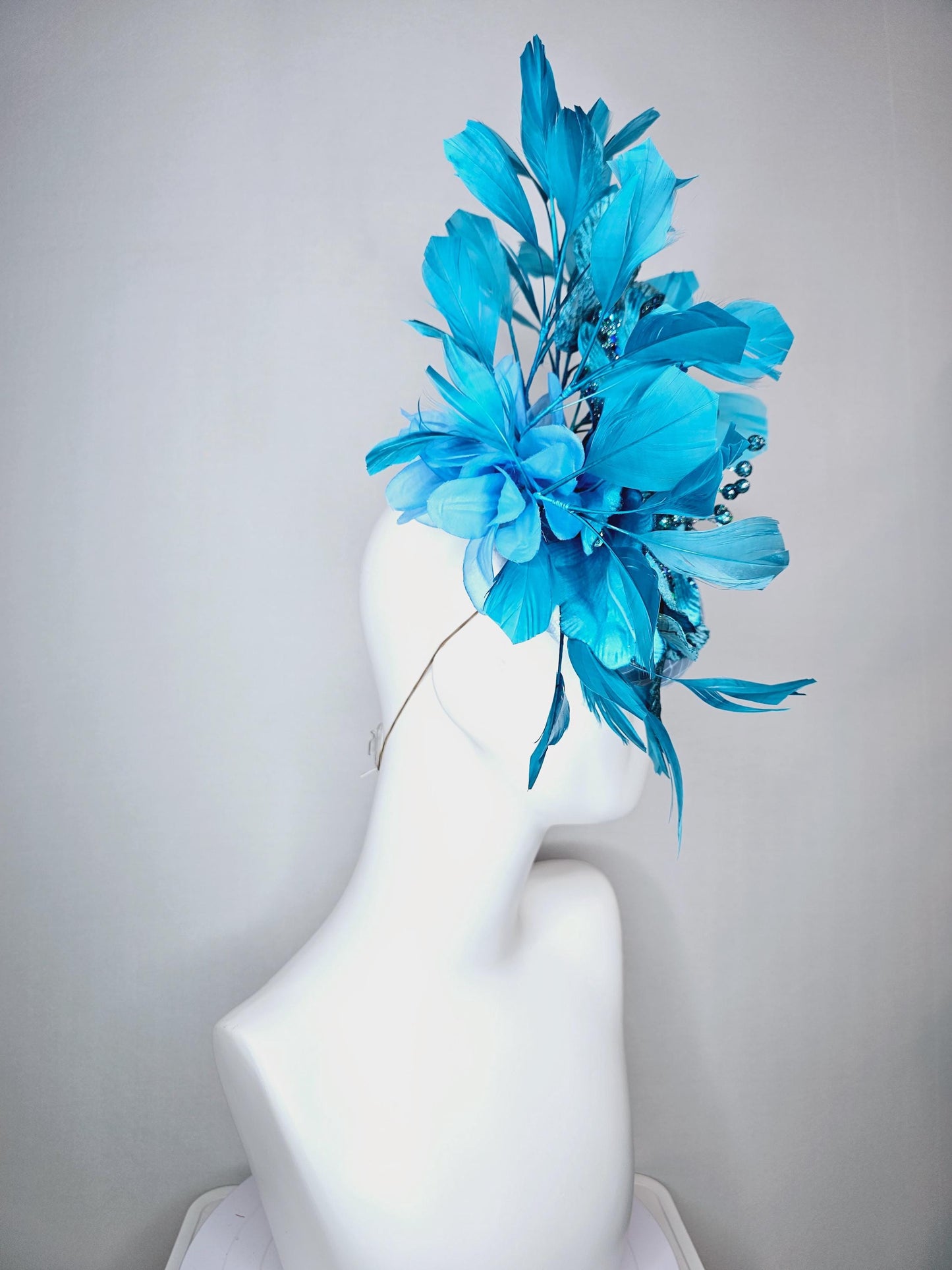 kentucky derby hat fascinator baby blue satin with netting large sky blue satin flower with sequin and leaves turquoise blue feathers