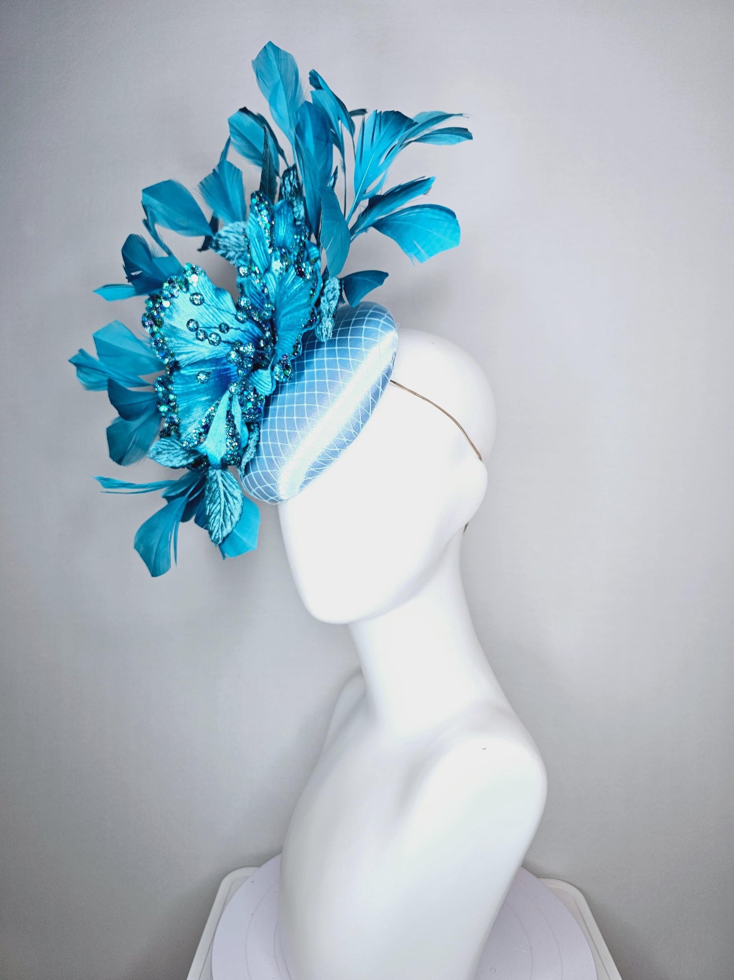 kentucky derby hat fascinator baby blue satin with netting large sky blue satin flower with sequin and leaves turquoise blue feathers