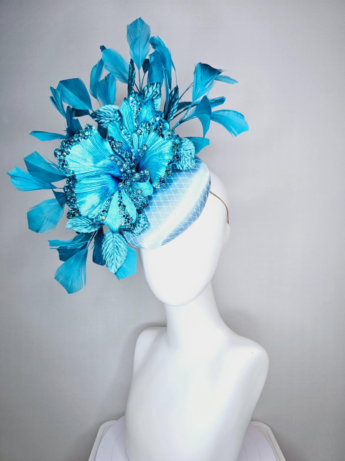 kentucky derby hat fascinator baby blue satin with netting large sky blue satin flower with sequin and leaves turquoise blue feathers