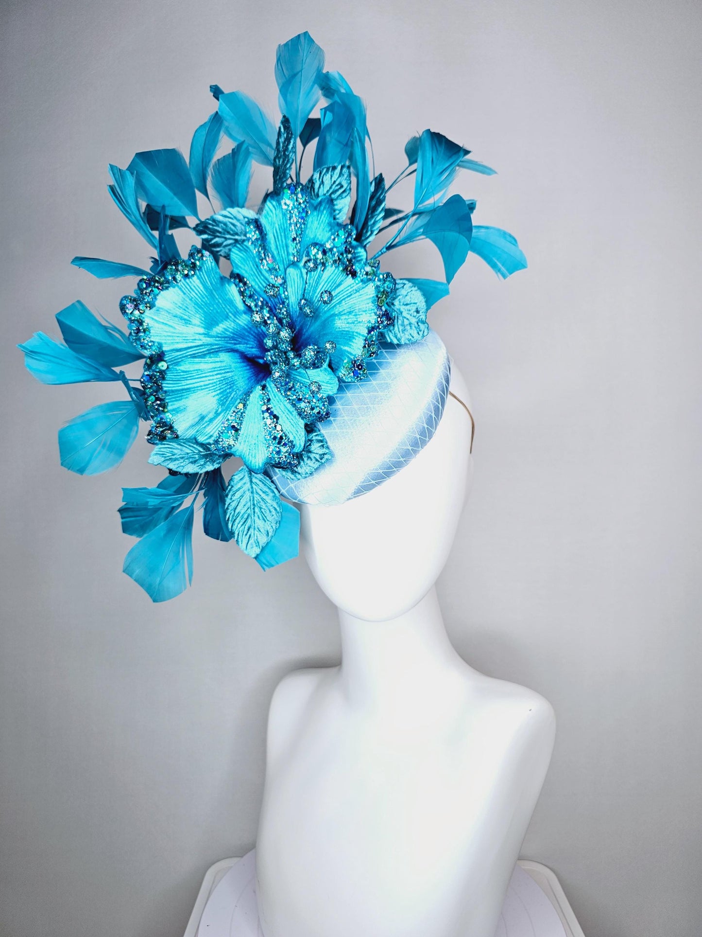 kentucky derby hat fascinator baby blue satin with netting large sky blue satin flower with sequin and leaves turquoise blue feathers