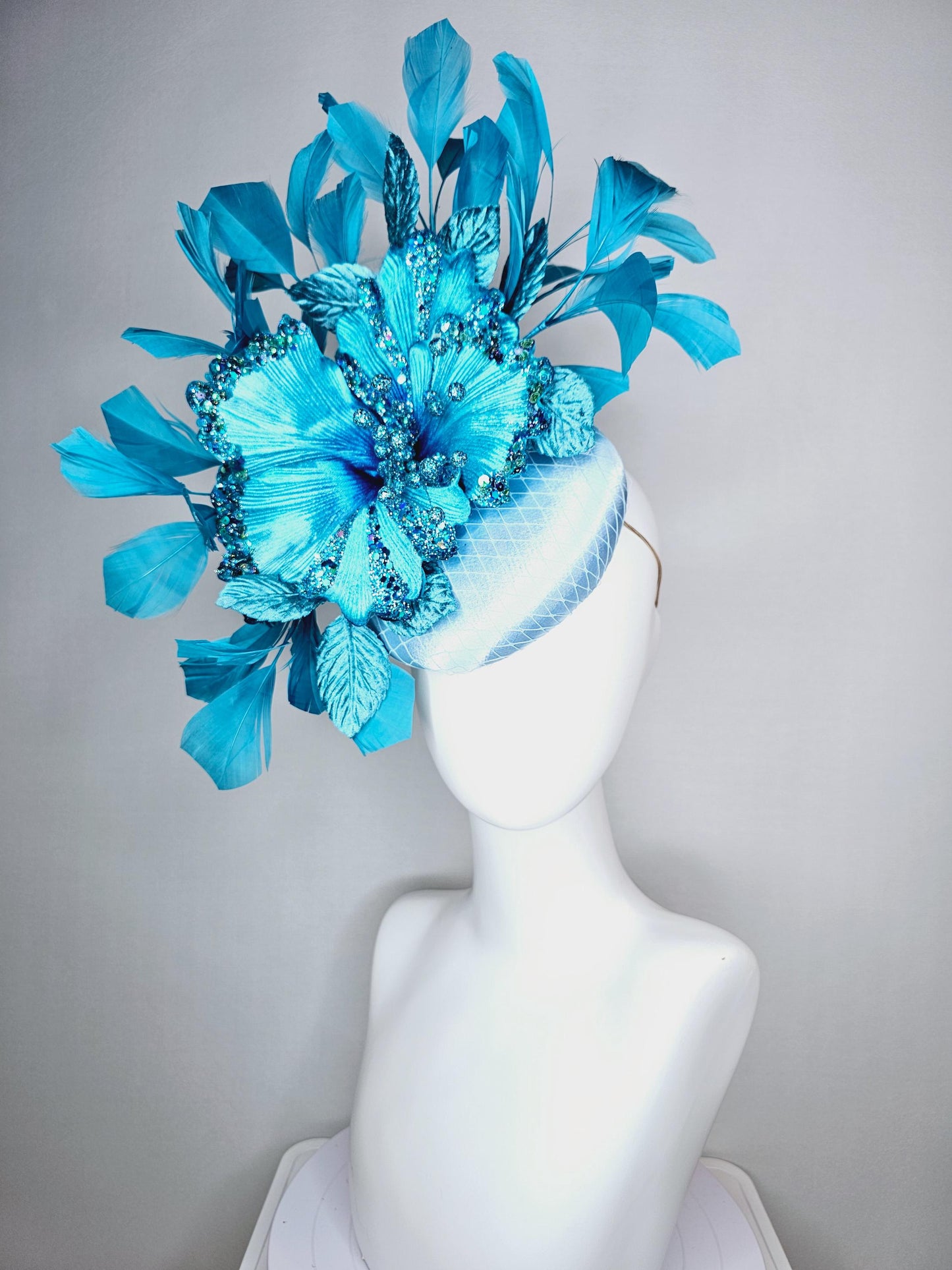 kentucky derby hat fascinator baby blue satin with netting large sky blue satin flower with sequin and leaves turquoise blue feathers