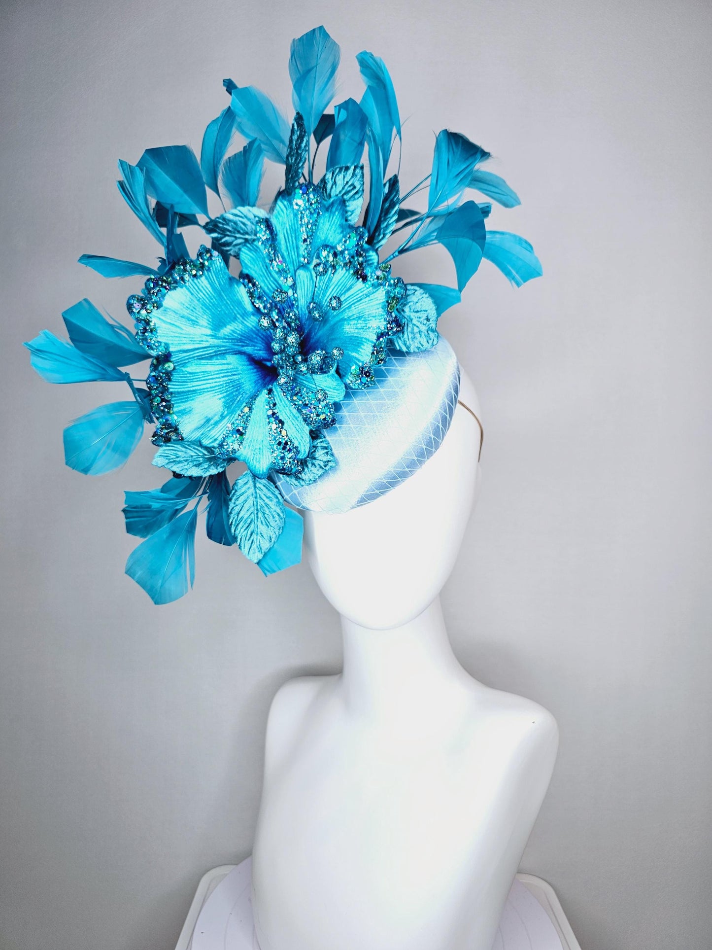 kentucky derby hat fascinator baby blue satin with netting large sky blue satin flower with sequin and leaves turquoise blue feathers