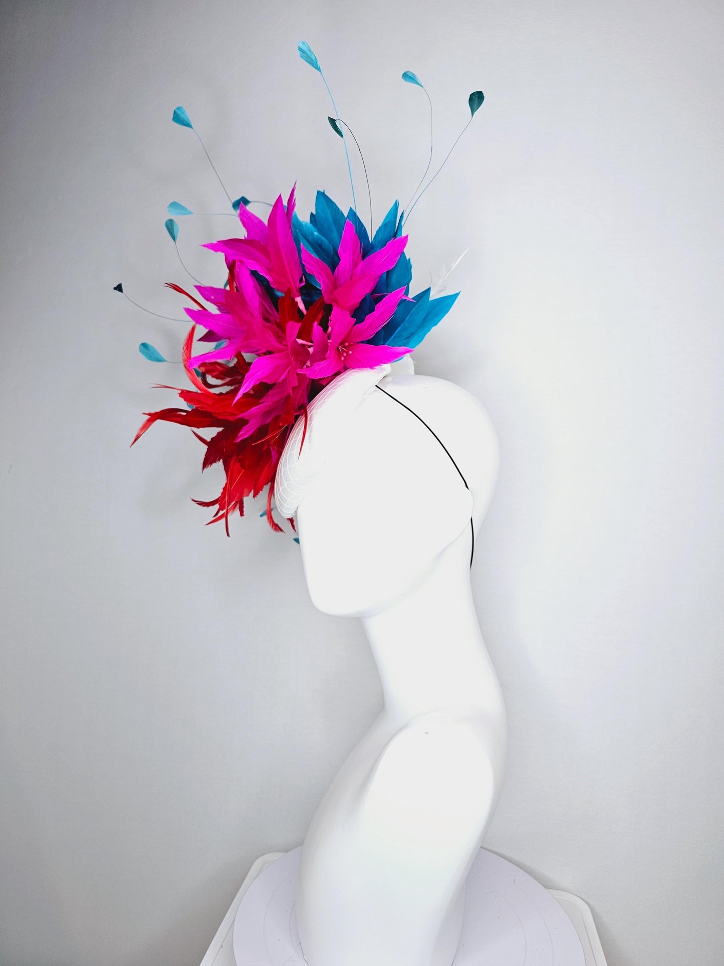 kentucky derby hat fascinator colorful white satin with netting scarlet red and bright fuchsia pink feather flowers and teal blue feathers