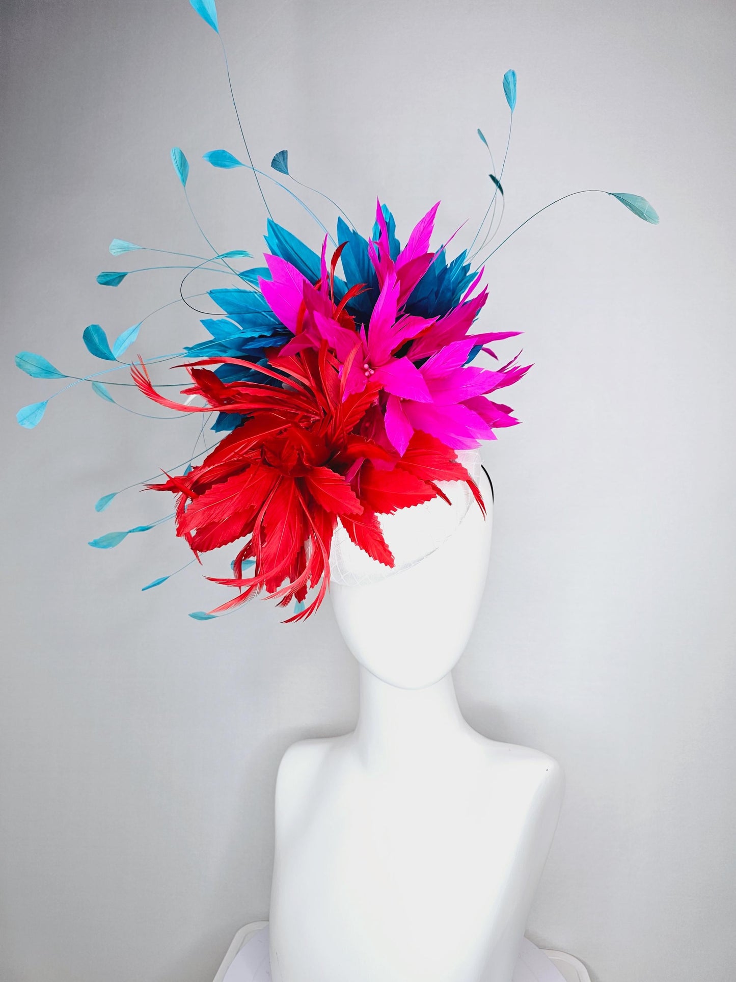 kentucky derby hat fascinator colorful white satin with netting scarlet red and bright fuchsia pink feather flowers and teal blue feathers