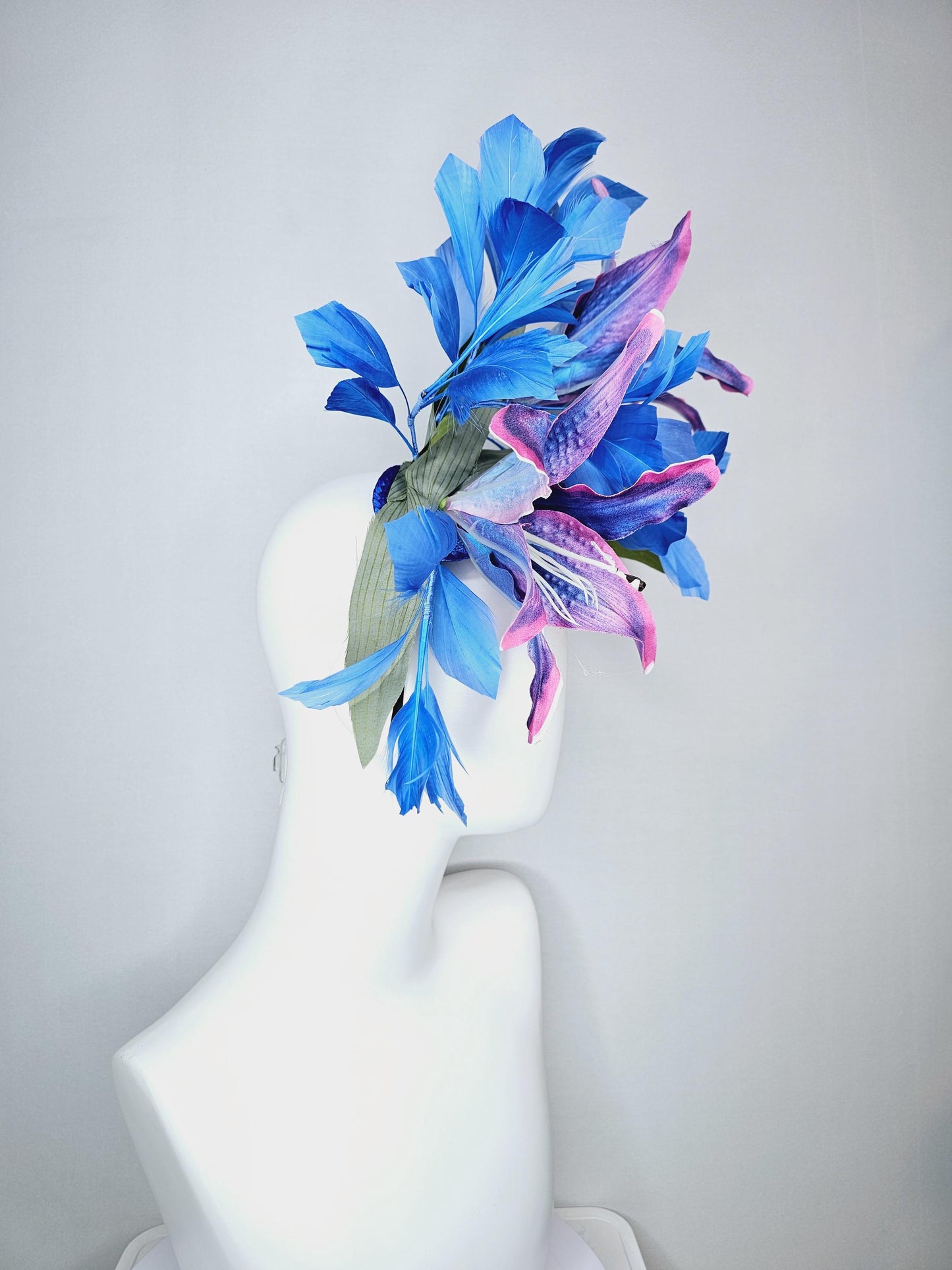 kentucky derby hat fascinator cobalt blue and pink ombre satin silk flowers with pastel green leaves and cobalt blue branching feathers