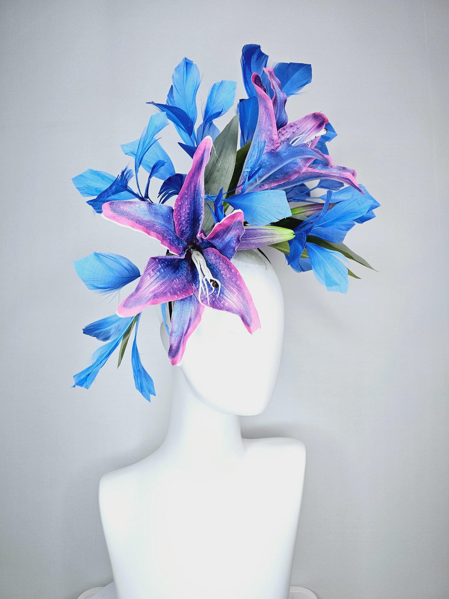 kentucky derby hat fascinator cobalt blue and pink ombre satin silk flowers with pastel green leaves and cobalt blue branching feathers