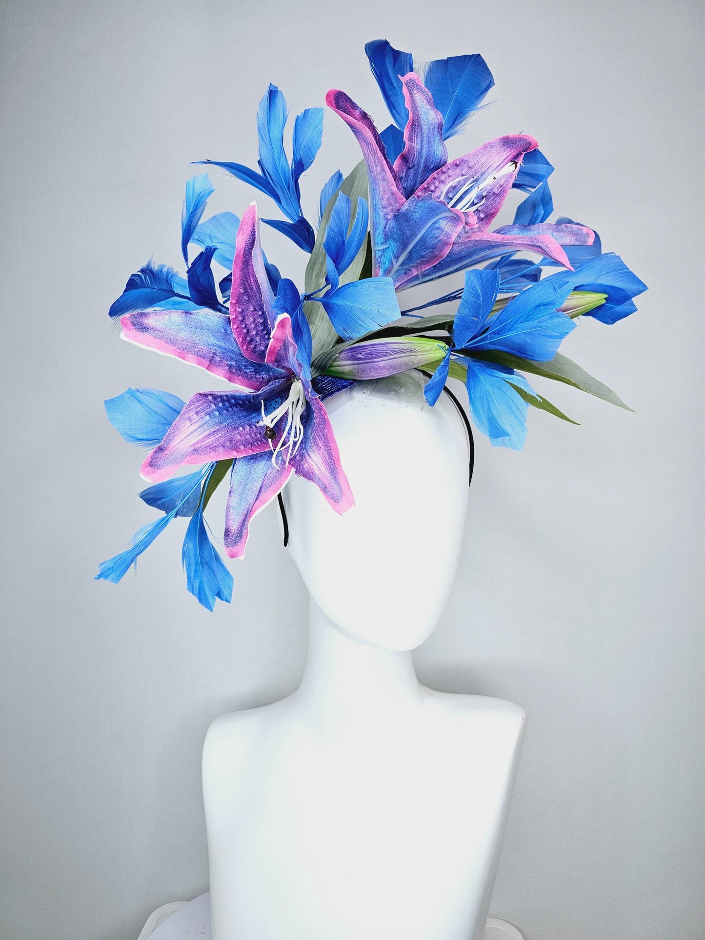 kentucky derby hat fascinator cobalt blue and pink ombre satin silk flowers with pastel green leaves and cobalt blue branching feathers