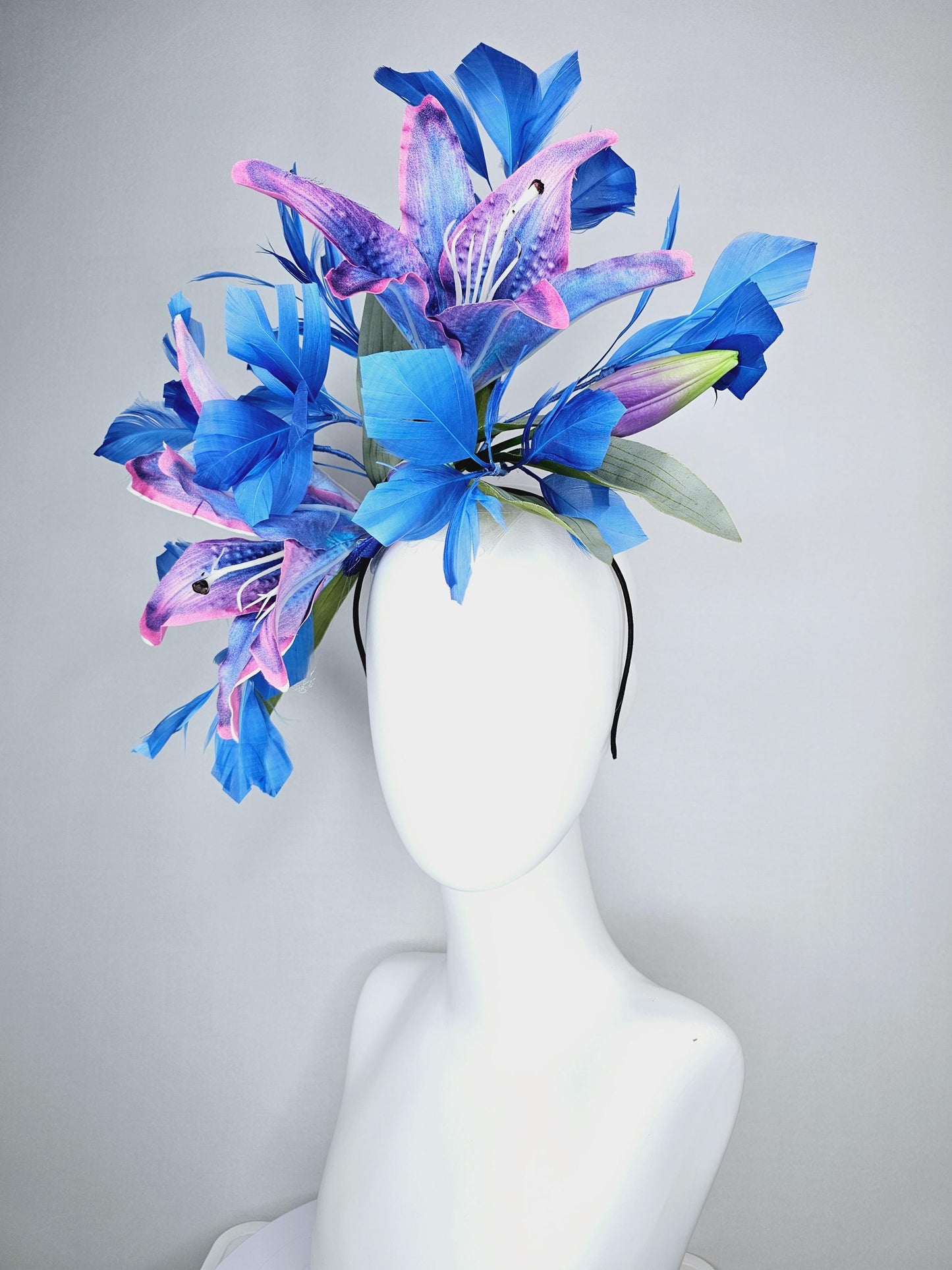 kentucky derby hat fascinator cobalt blue and pink ombre satin silk flowers with pastel green leaves and cobalt blue branching feathers