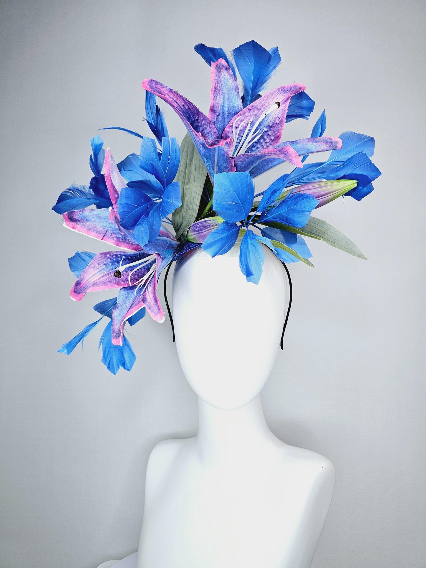 kentucky derby hat fascinator cobalt blue and pink ombre satin silk flowers with pastel green leaves and cobalt blue branching feathers