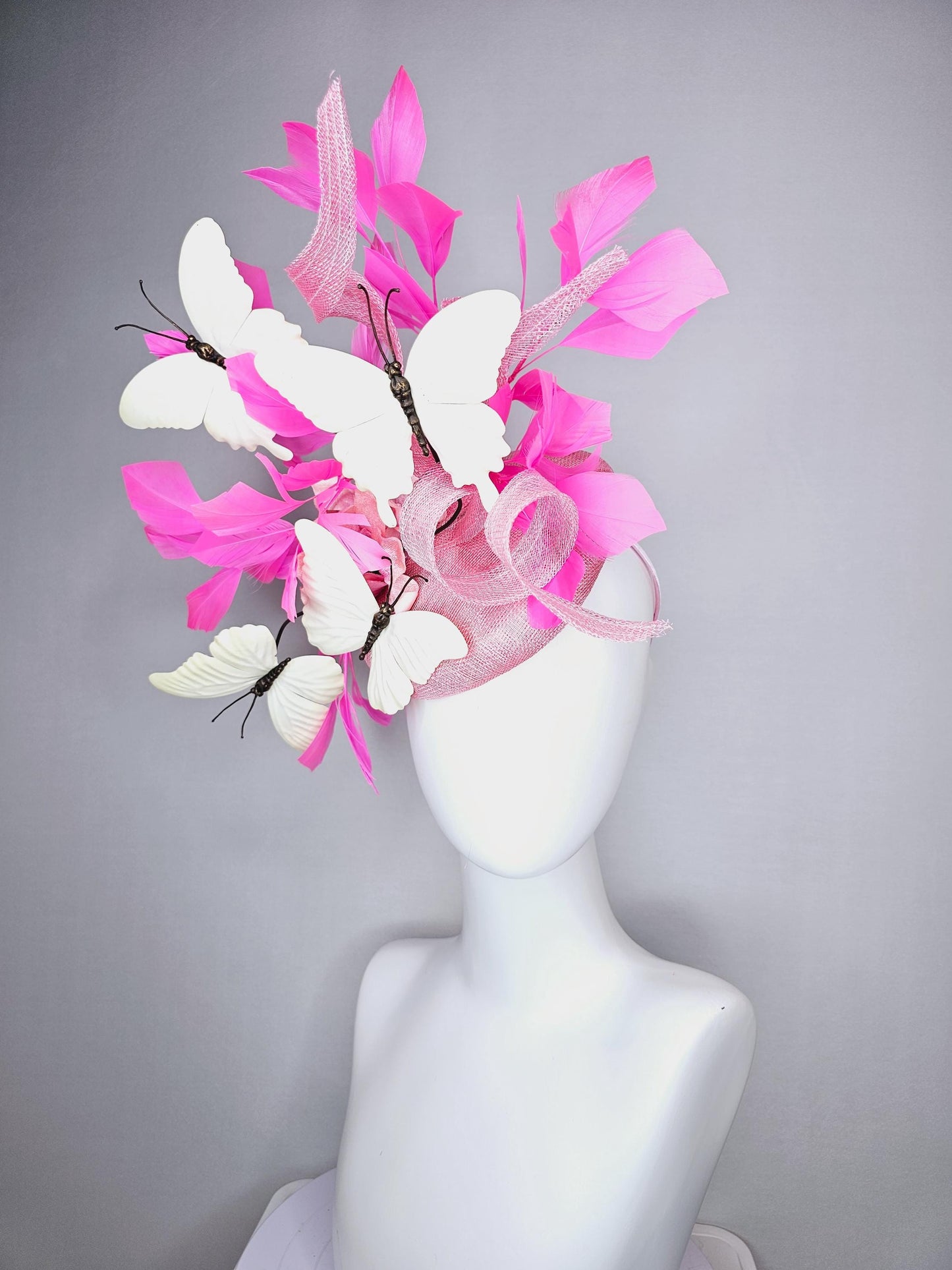 kentucky derby hat fascinator baby pink sinamay with tall curls baby pink satin flower white large butterflies and pink branching feathers