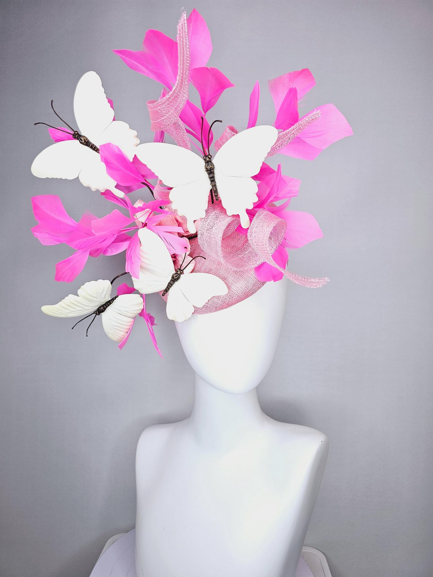 kentucky derby hat fascinator baby pink sinamay with tall curls baby pink satin flower white large butterflies and pink branching feathers