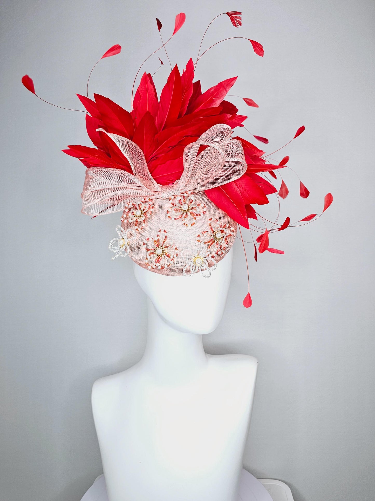 kentucky derby hat fascinator pink champagne sinamay with bow and pearl jewel embroidered flowers with scarlet red branching feathers