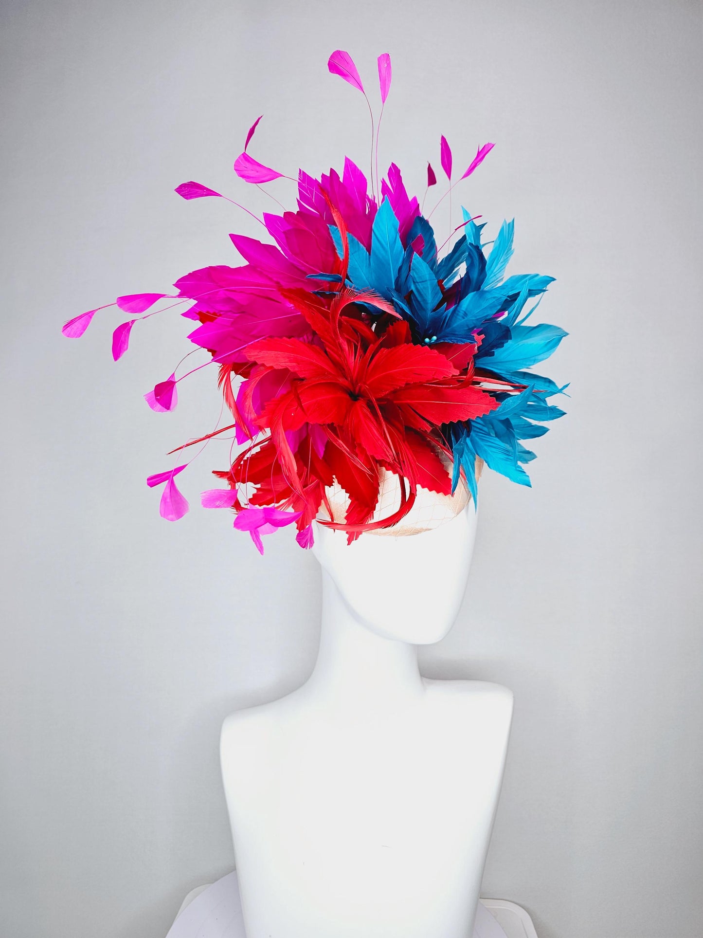kentucky derby hat fascinator colorful champagne pink satin with netting fluffy scarlet red zigzag feather flower fuchsia pink blue feathers