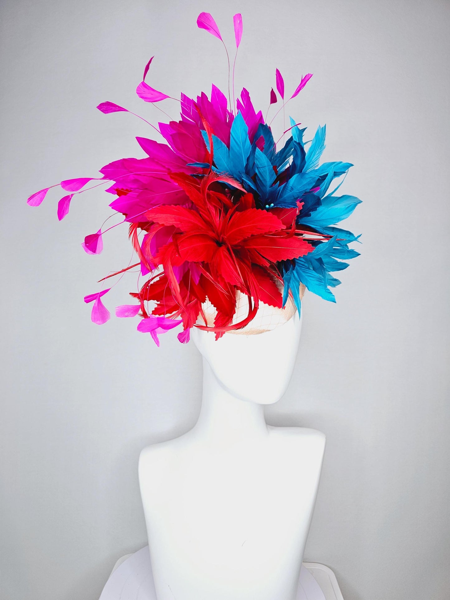 kentucky derby hat fascinator colorful champagne pink satin with netting fluffy scarlet red zigzag feather flower fuchsia pink blue feathers