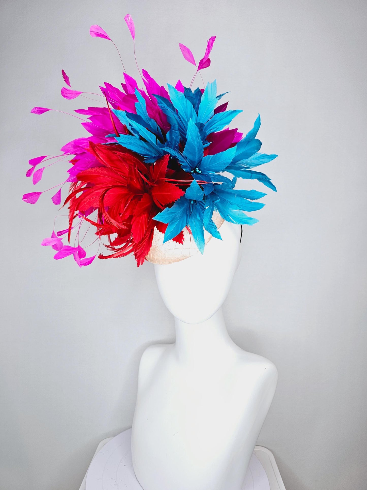 kentucky derby hat fascinator colorful champagne pink satin with netting fluffy scarlet red zigzag feather flower fuchsia pink blue feathers