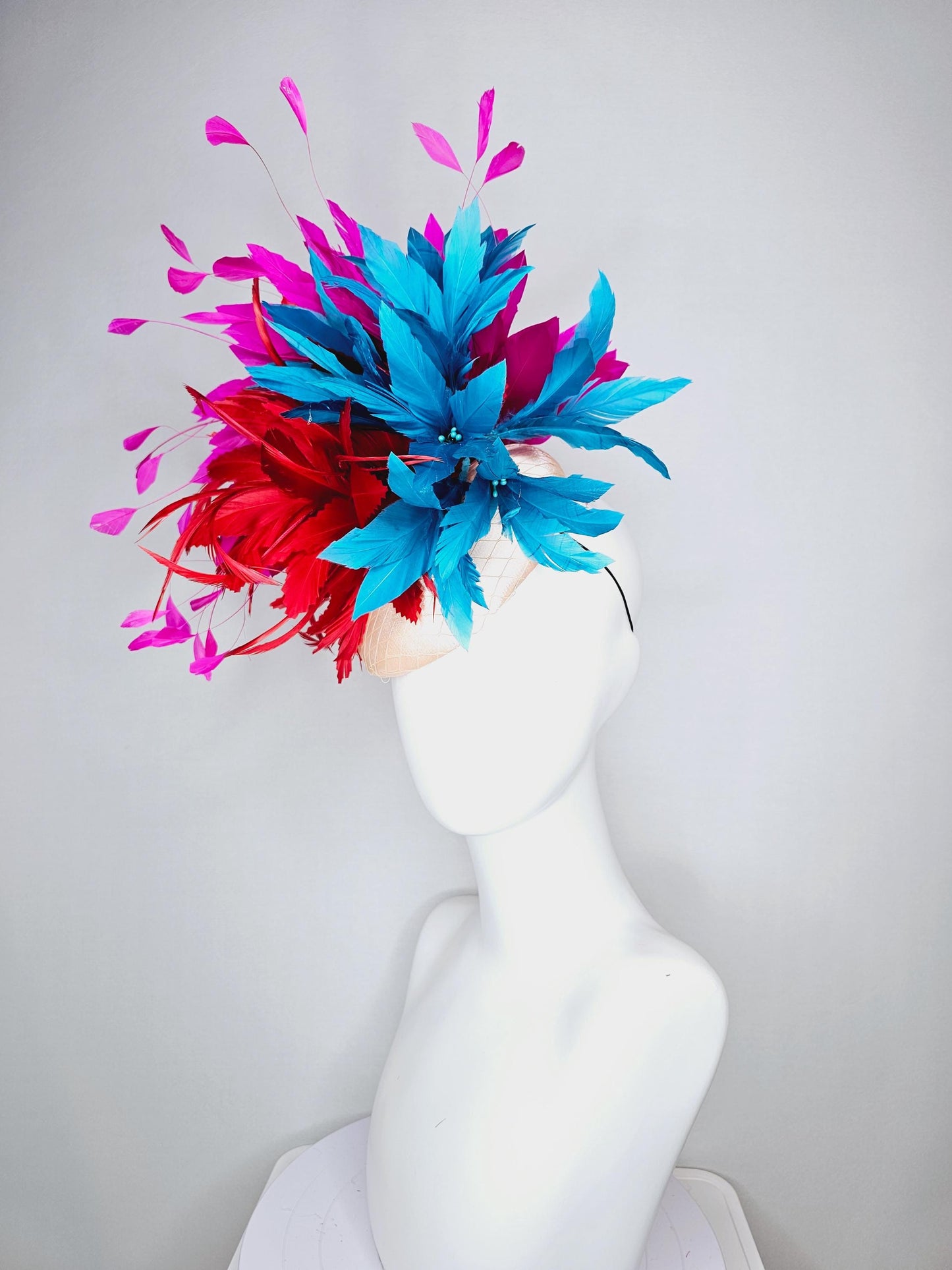 kentucky derby hat fascinator colorful champagne pink satin with netting fluffy scarlet red zigzag feather flower fuchsia pink blue feathers
