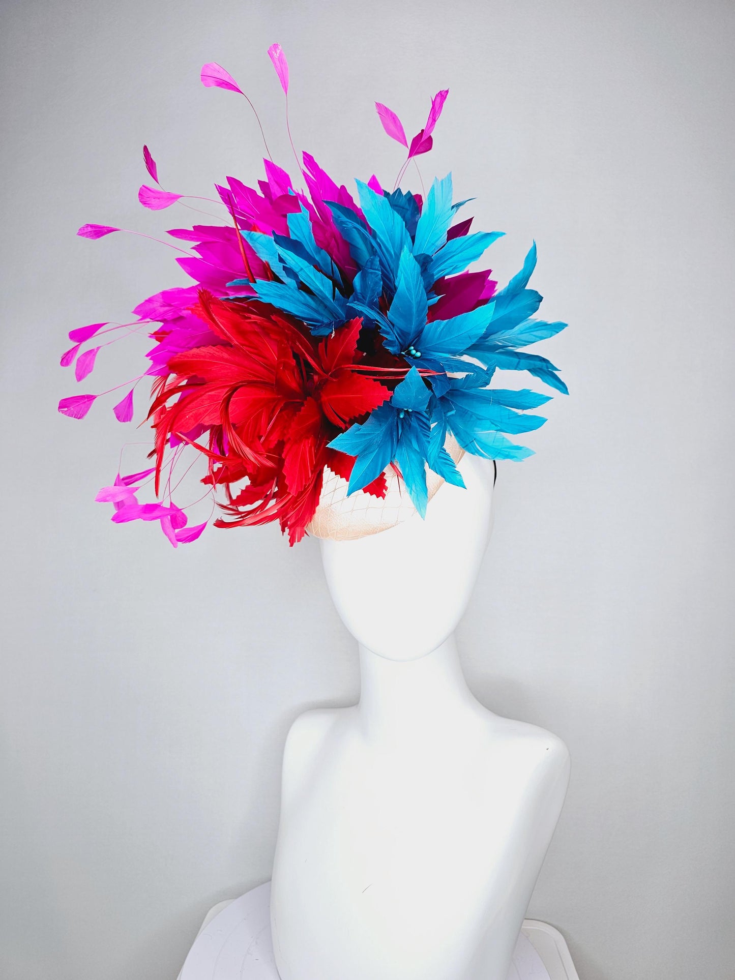 kentucky derby hat fascinator colorful champagne pink satin with netting fluffy scarlet red zigzag feather flower fuchsia pink blue feathers