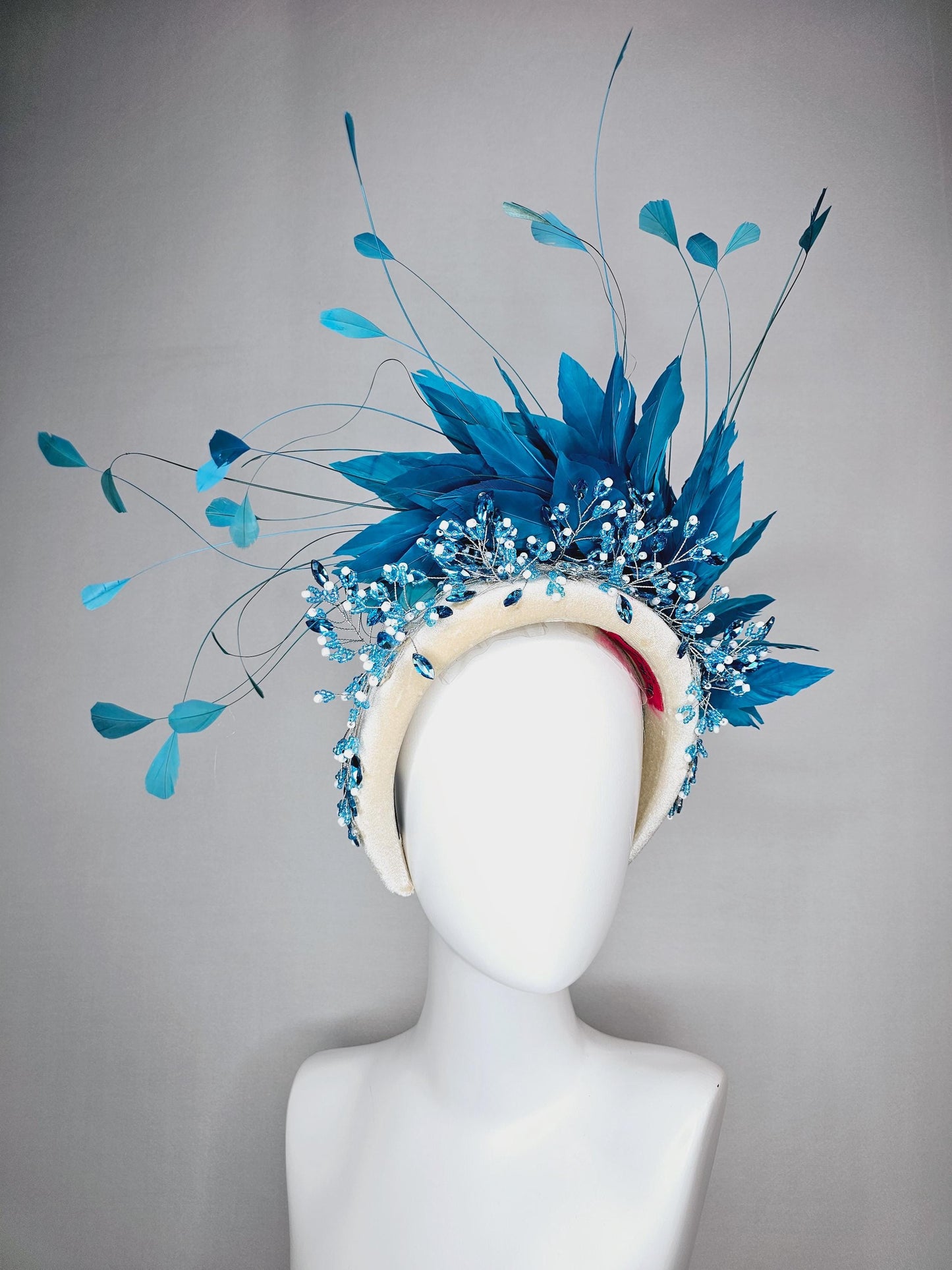 kentucky derby hat fascinator neutral cream velvet headband with blue crystal stems and bright blue branching feathers
