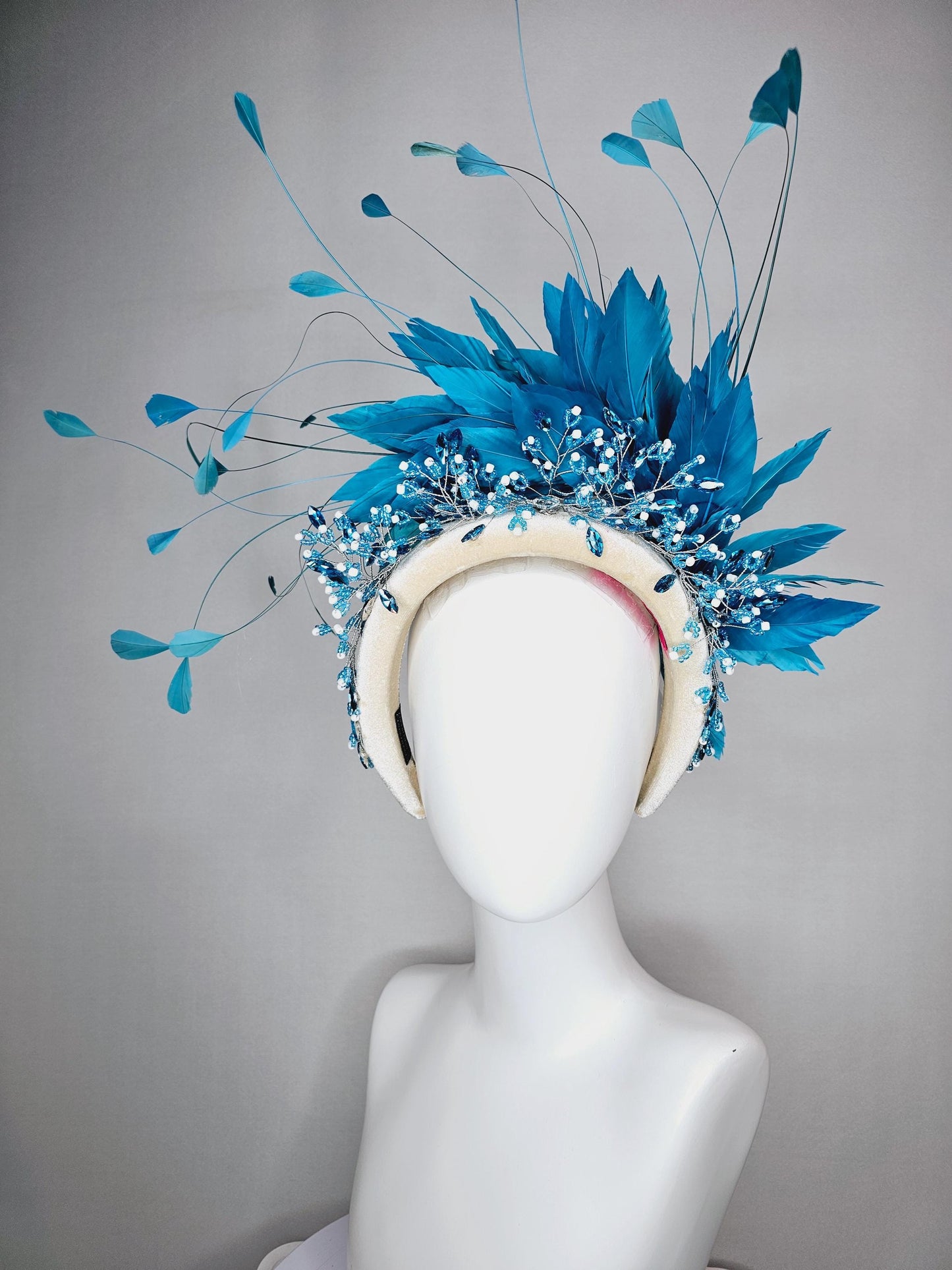 kentucky derby hat fascinator neutral cream velvet headband with blue crystal stems and bright blue branching feathers