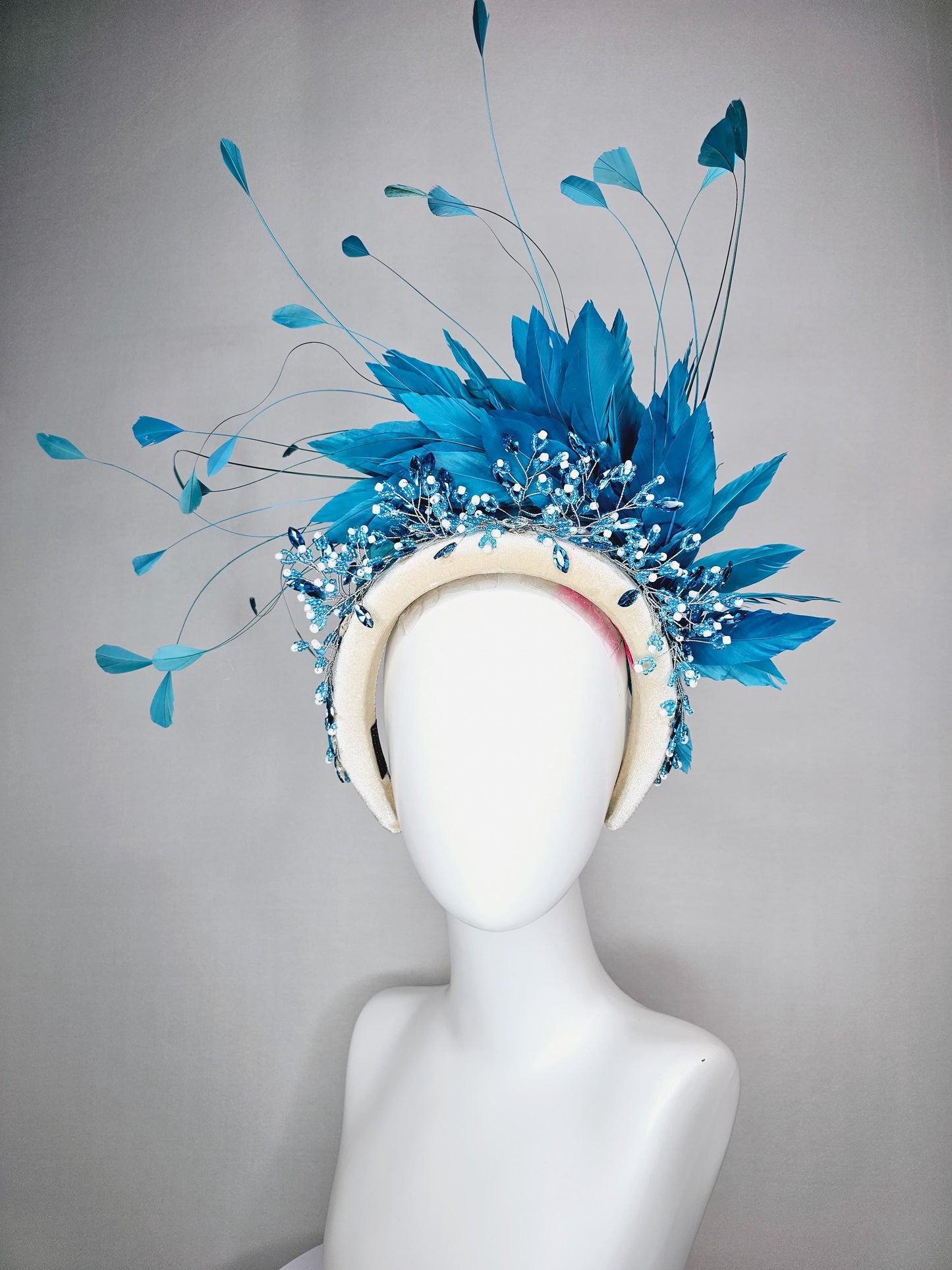 kentucky derby hat fascinator neutral cream velvet headband with blue crystal stems and bright blue branching feathers