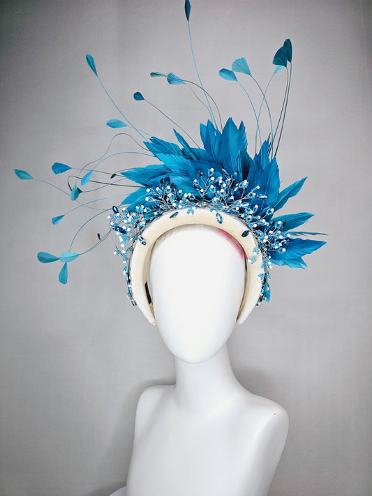 kentucky derby hat fascinator neutral cream velvet headband with blue crystal stems and bright blue branching feathers
