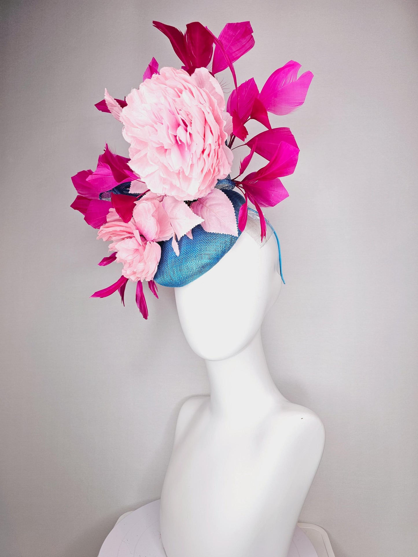 kentucky derby hat fascinator blue sinamay with bow and light pink peony satin flowers light pink leaves hot bright pink branching feathers