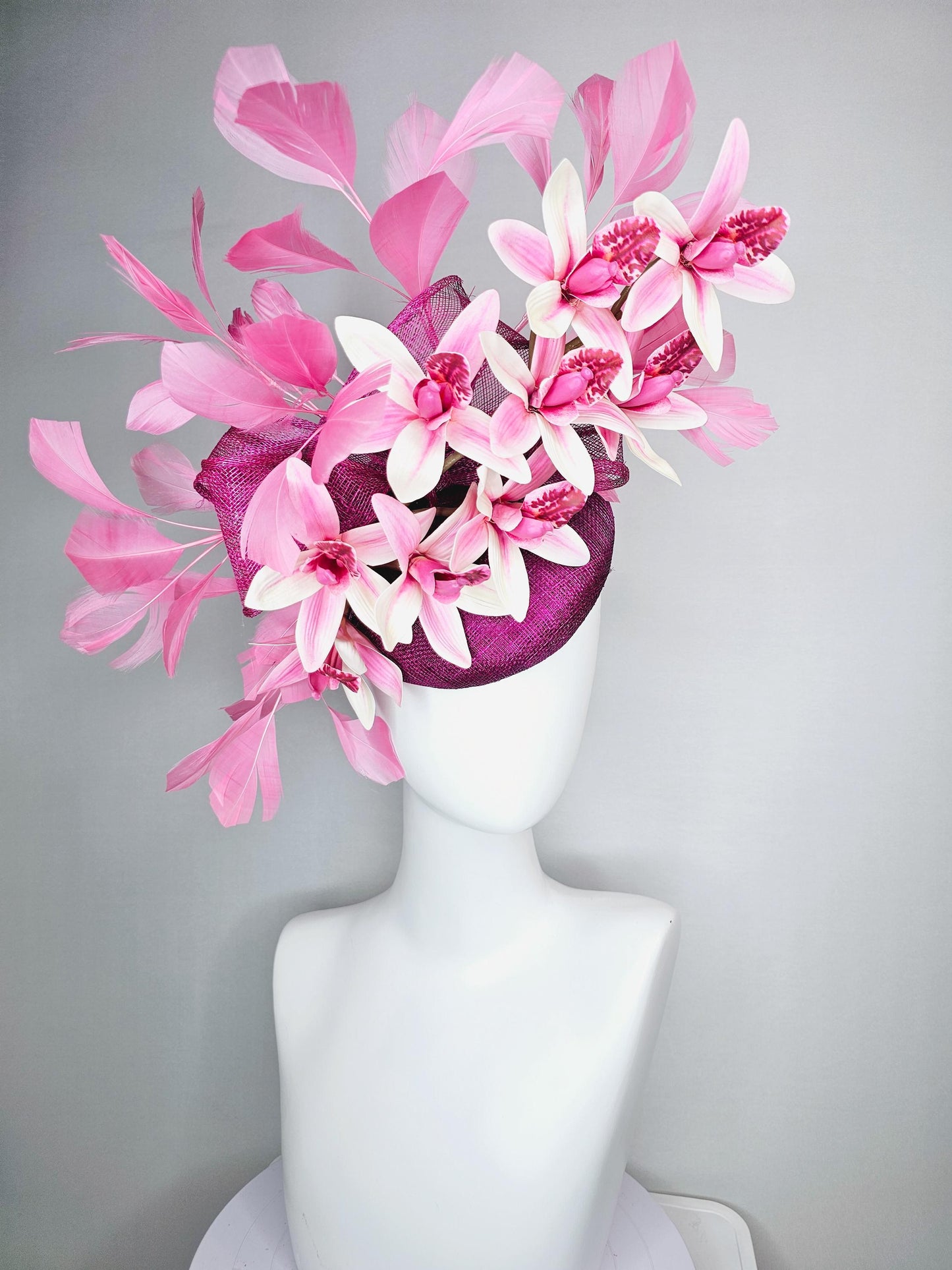 kentucky derby hat fascinator magenta purple sinamay with bow and white and pink satin orchid flowers with blush pink branching feathers
