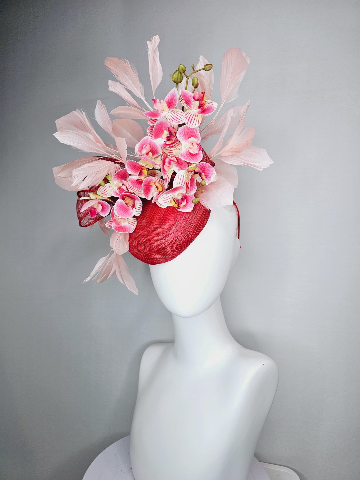 kentucky derby hat fascinator red sinamay with bow and white raspberry red pink satin orchid flowers with champagne pink branching feathers