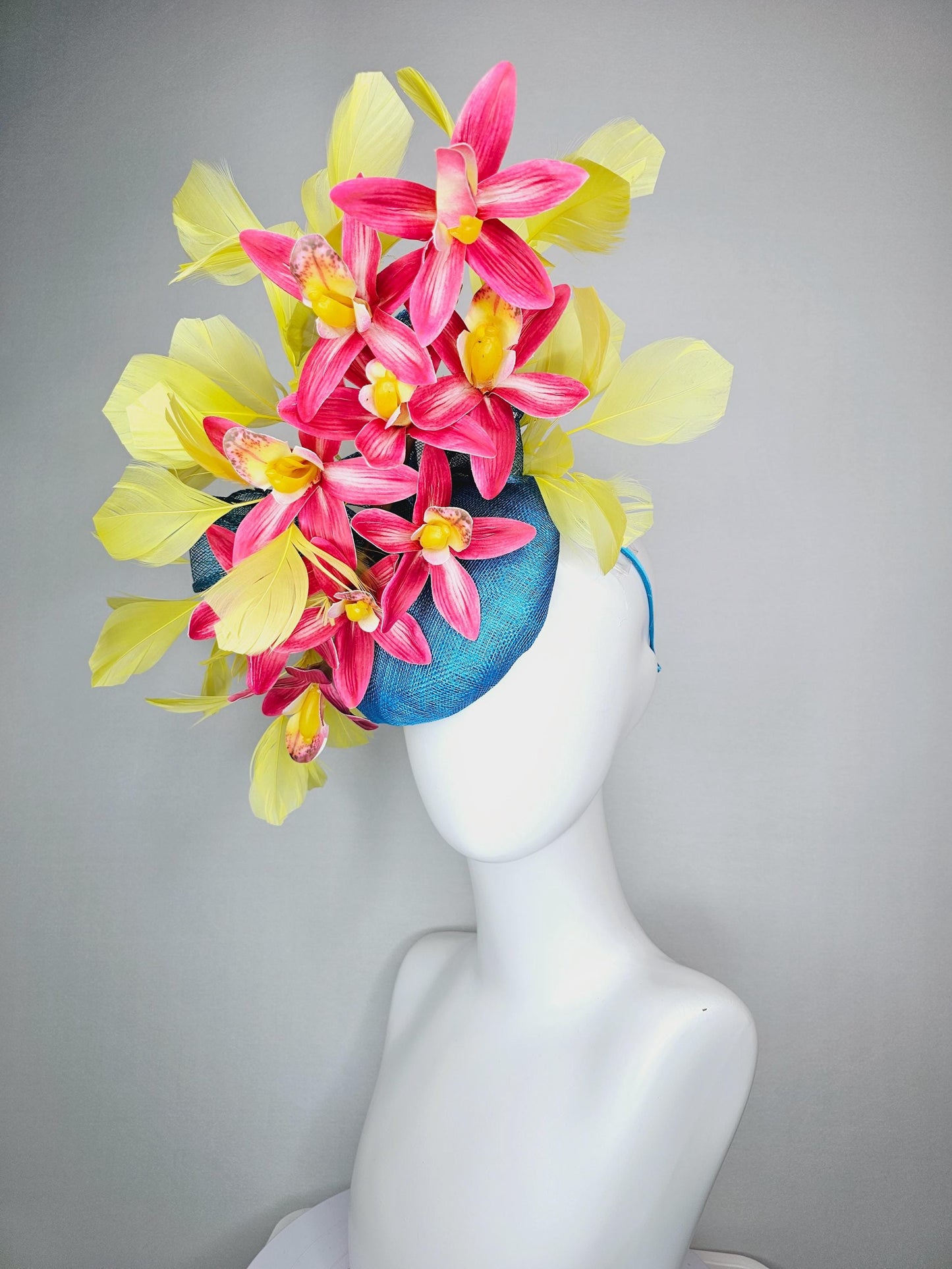 kentucky derby hat fascinator turquoise blue sinamay with bow and raspberry red satin orchid flowers with yellow branching feathers