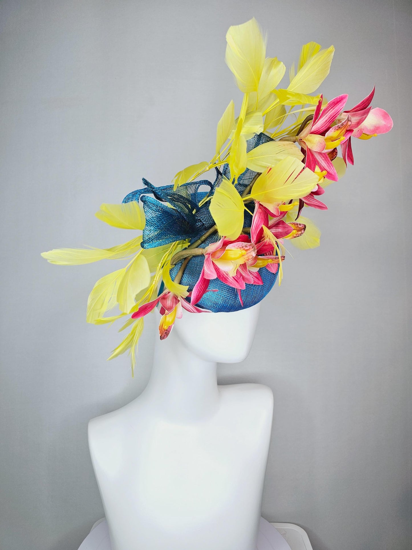 kentucky derby hat fascinator turquoise blue sinamay with bow and raspberry red satin orchid flowers with yellow branching feathers