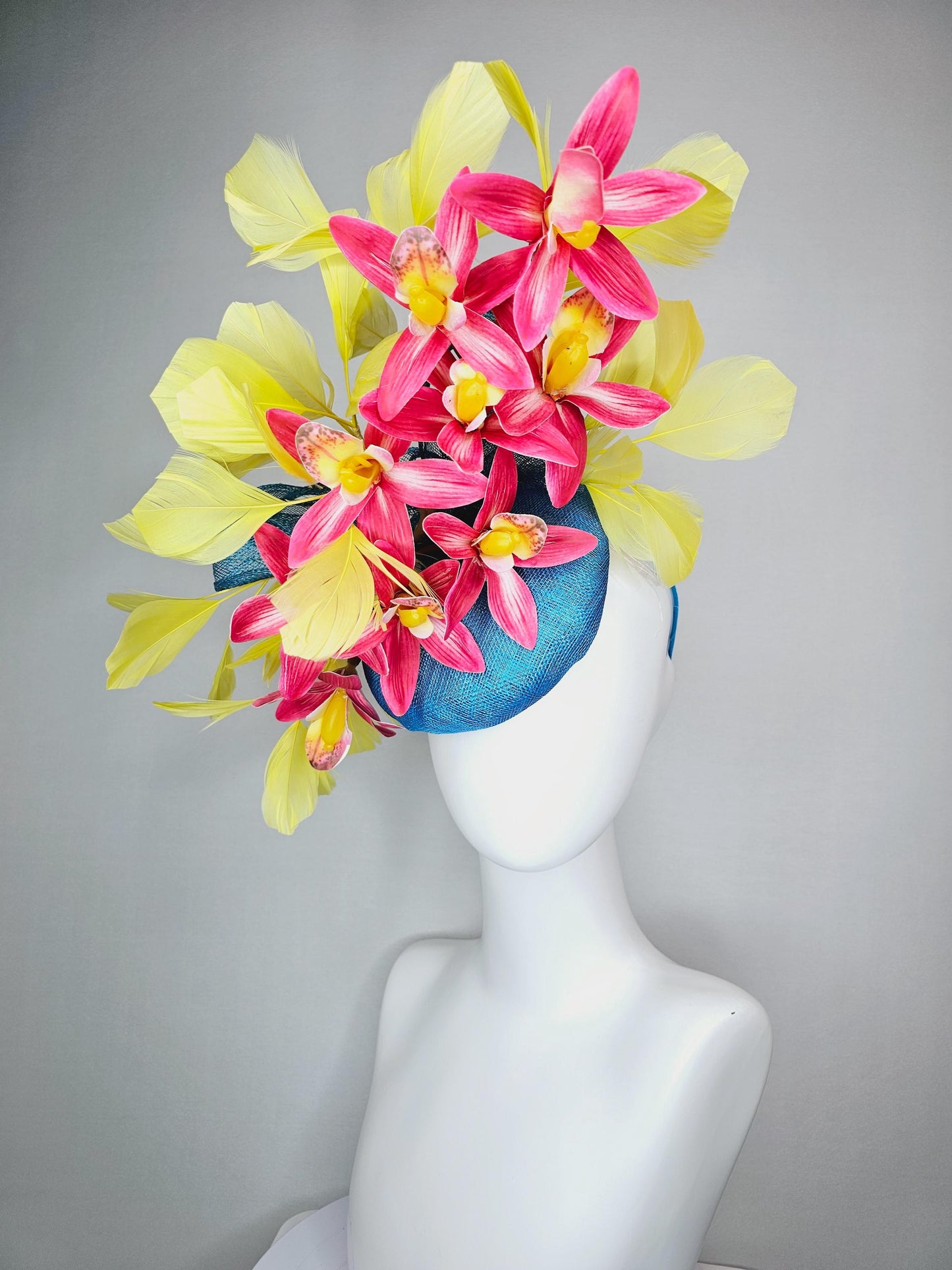 kentucky derby hat fascinator turquoise blue sinamay with bow and raspberry red satin orchid flowers with yellow branching feathers