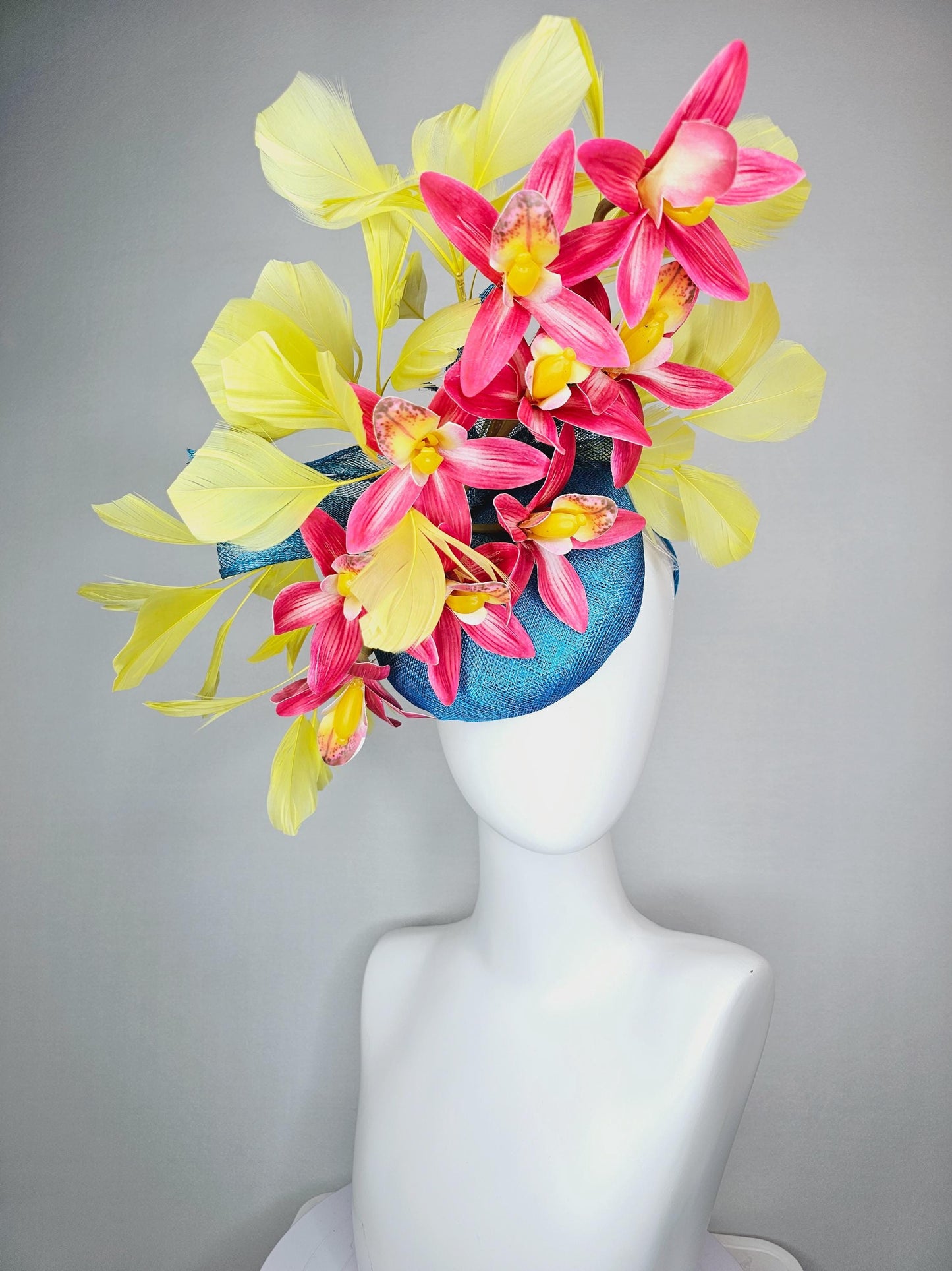 kentucky derby hat fascinator turquoise blue sinamay with bow and raspberry red satin orchid flowers with yellow branching feathers