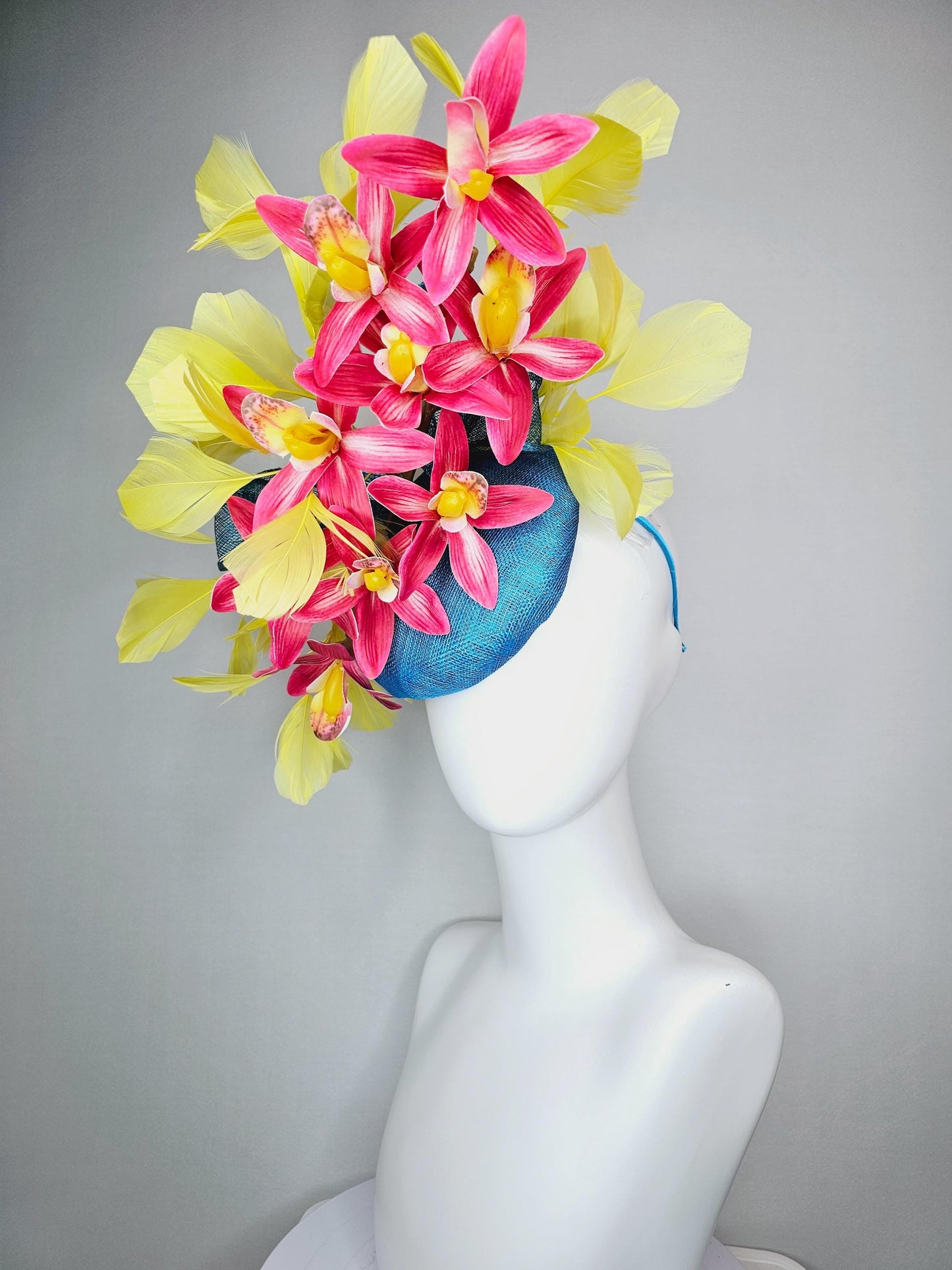 kentucky derby hat fascinator turquoise blue sinamay with bow and raspberry red satin orchid flowers with yellow branching feathers