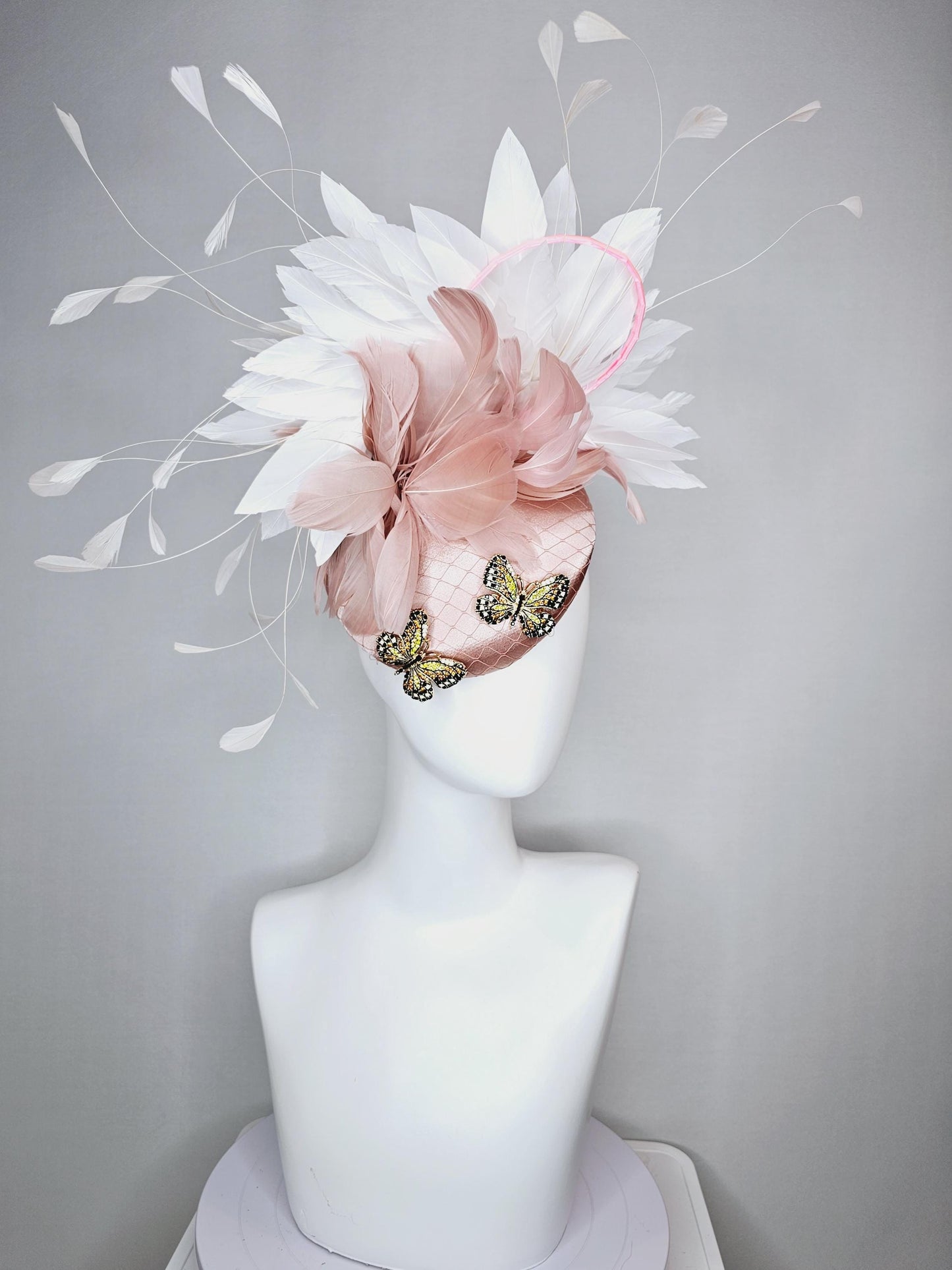kentucky derby hat fascinator champagne pink satin with netting and colorful crystal jewels butterflies dusty pink white branching feathers