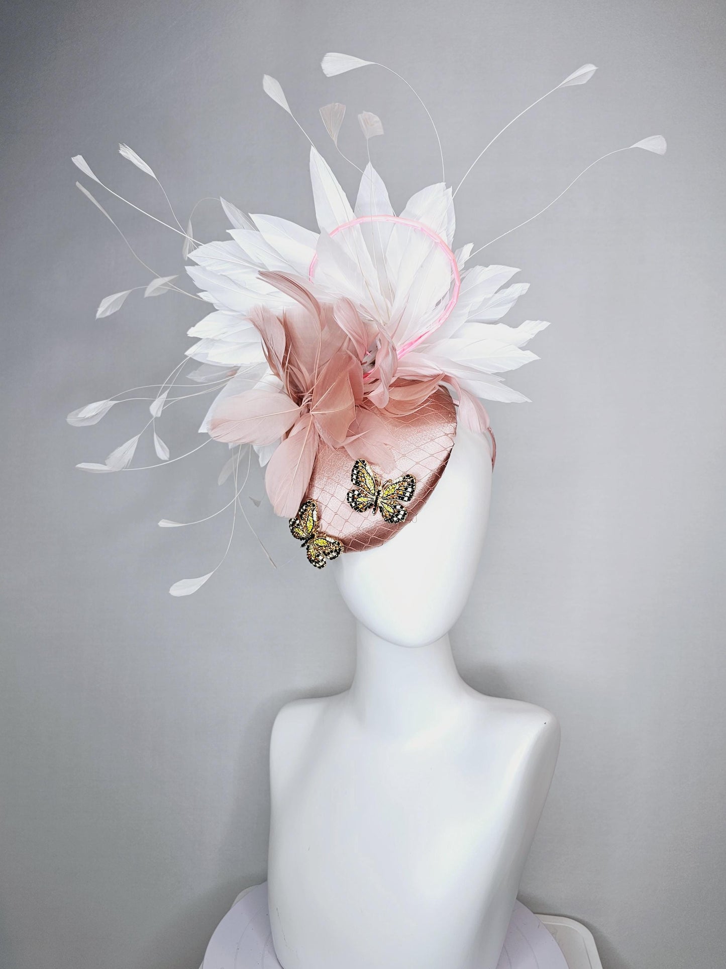 kentucky derby hat fascinator champagne pink satin with netting and colorful crystal jewels butterflies dusty pink white branching feathers
