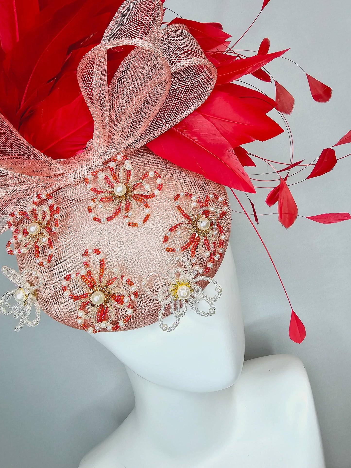 kentucky derby hat fascinator pink champagne sinamay with bow and pearl jewel embroidered flowers with scarlet red branching feathers