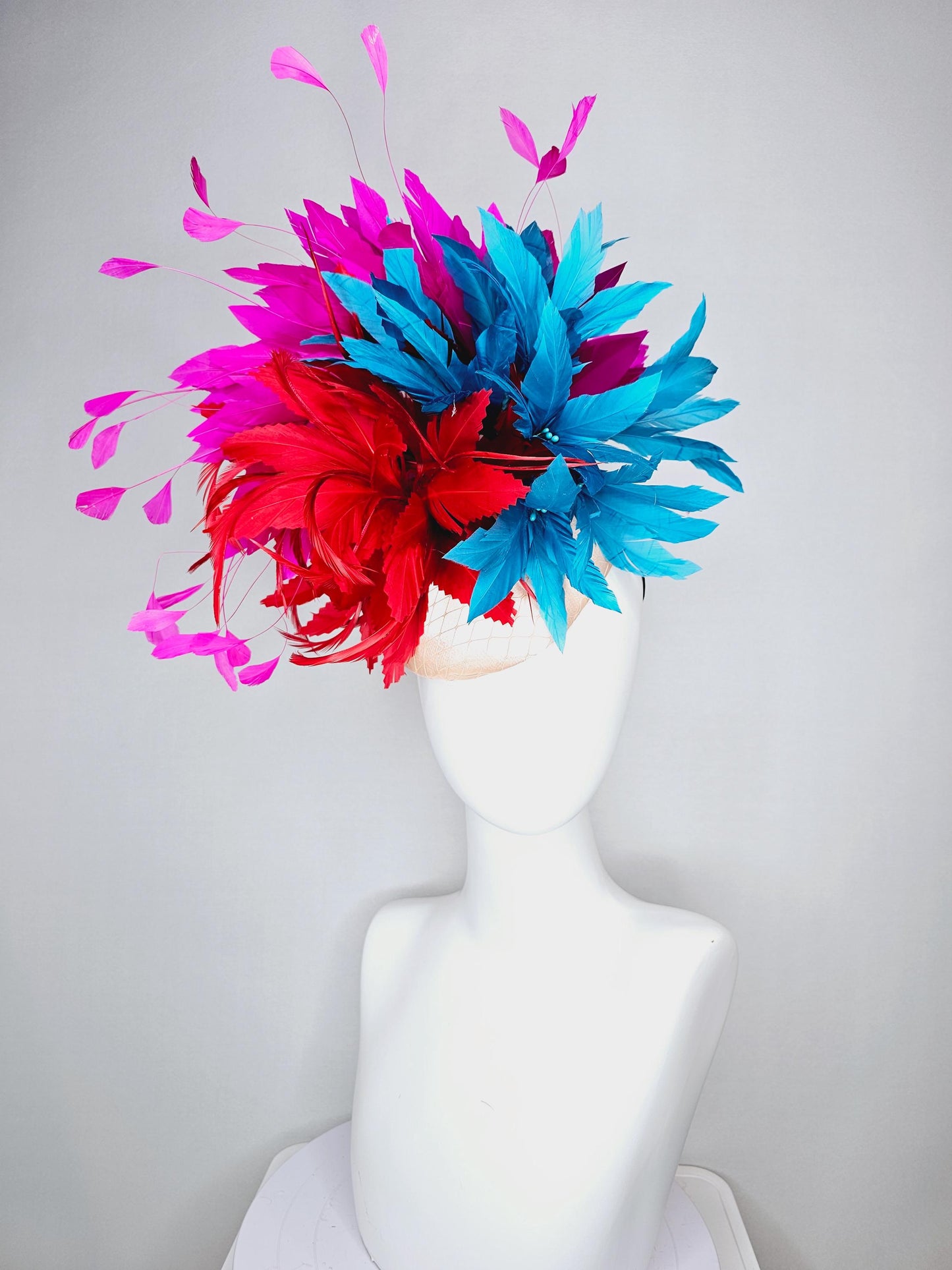 kentucky derby hat fascinator colorful champagne pink satin with netting fluffy scarlet red zigzag feather flower fuchsia pink blue feathers