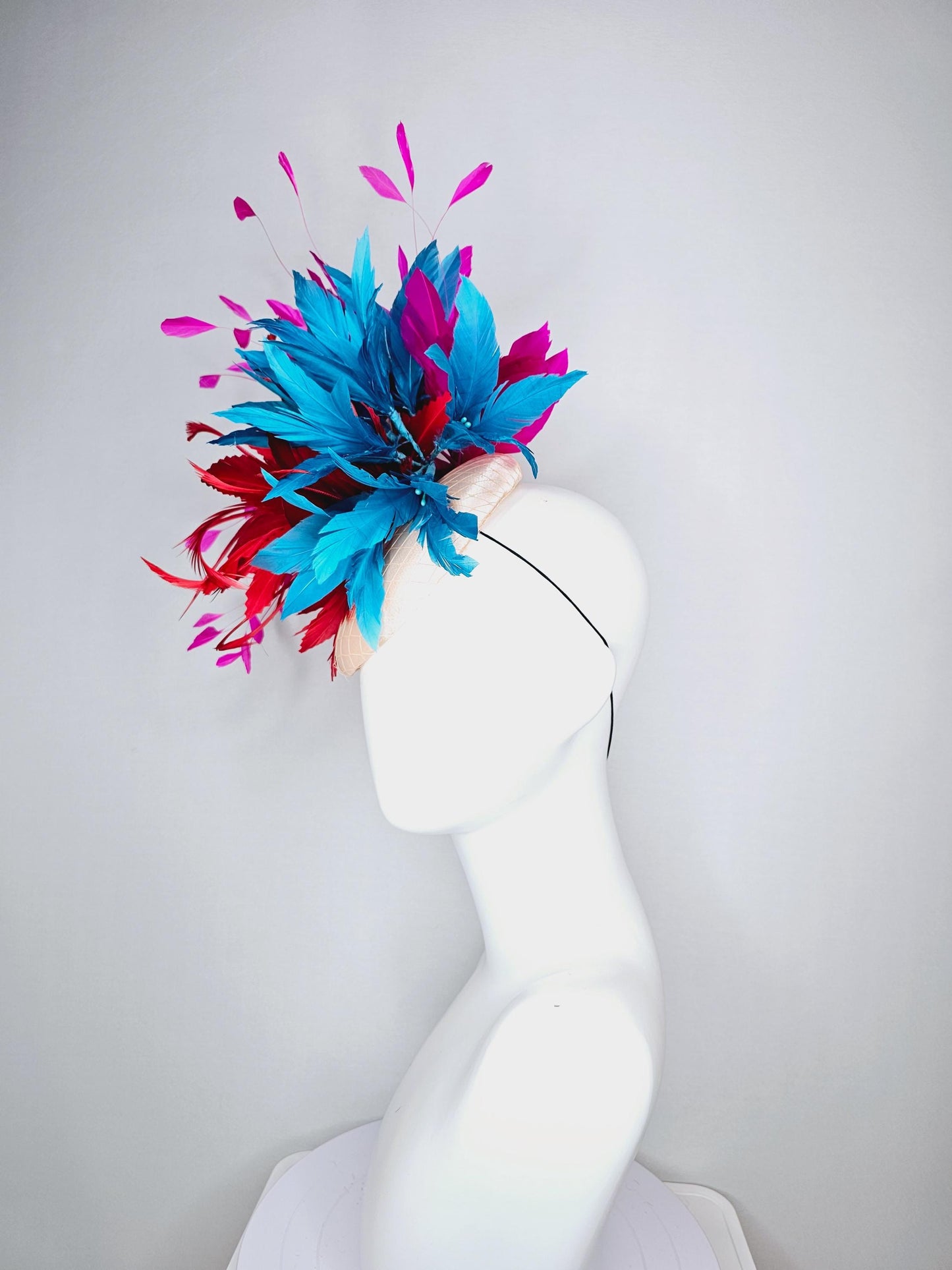 kentucky derby hat fascinator colorful champagne pink satin with netting fluffy scarlet red zigzag feather flower fuchsia pink blue feathers