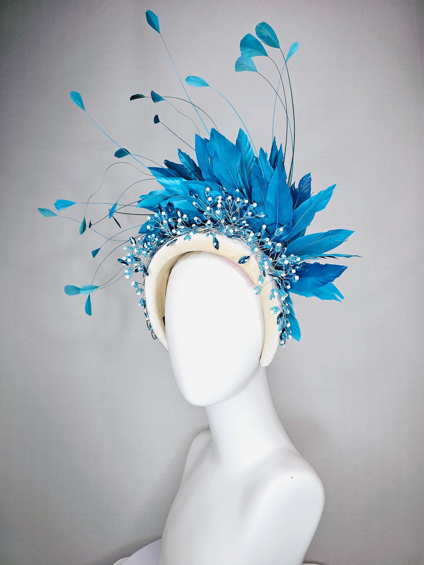 kentucky derby hat fascinator neutral cream velvet headband with blue crystal stems and bright blue branching feathers