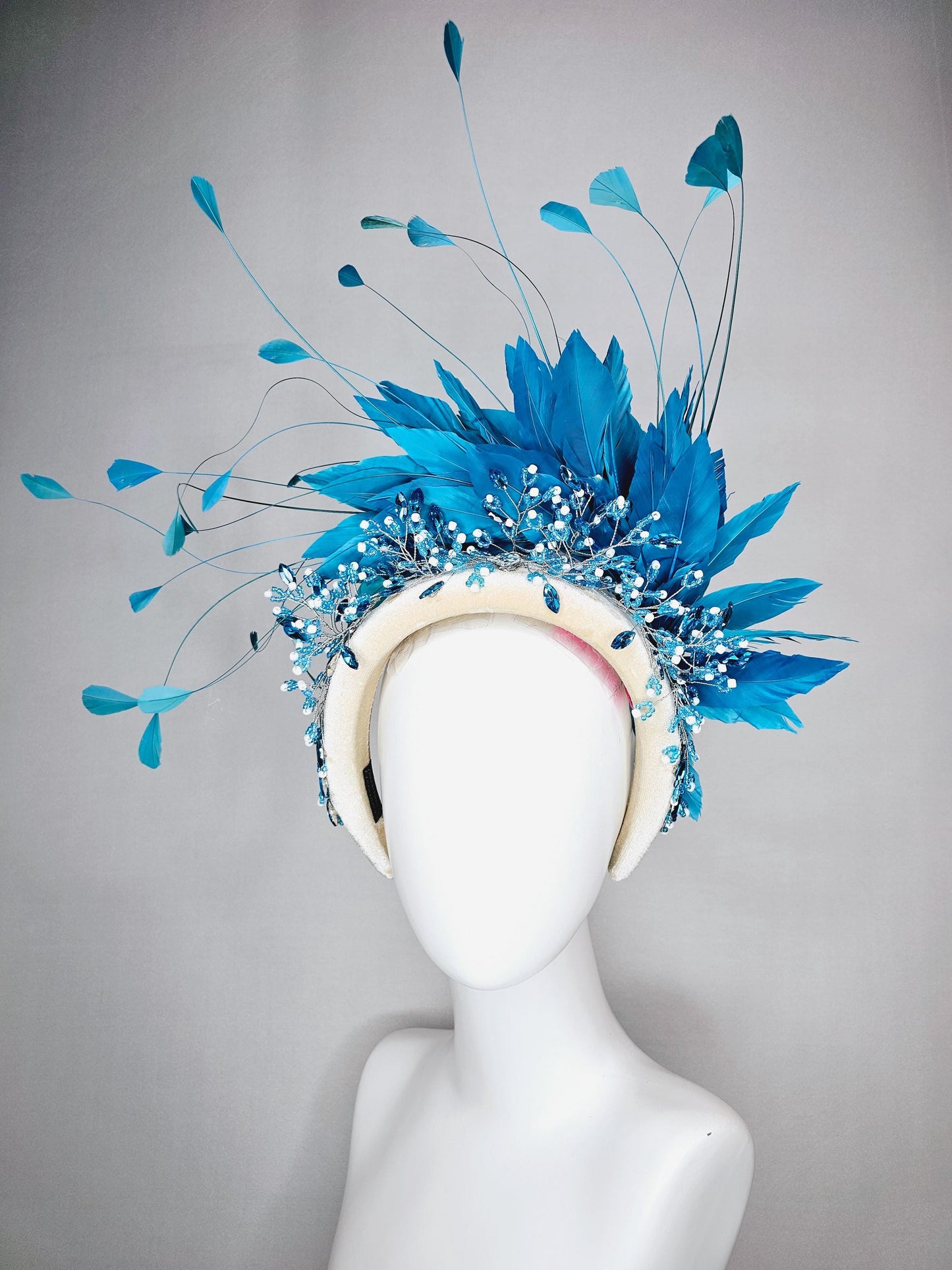 kentucky derby hat fascinator neutral cream velvet headband with blue crystal stems and bright blue branching feathers
