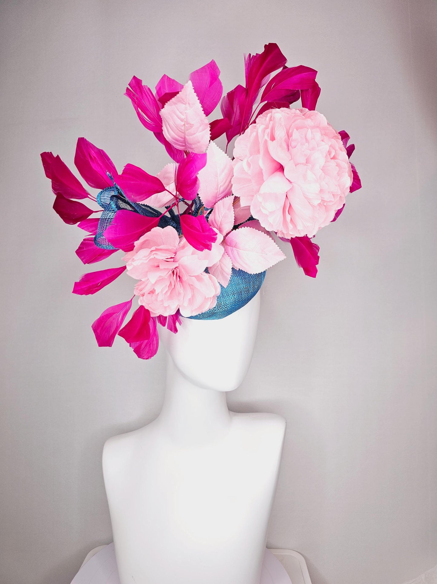 kentucky derby hat fascinator blue sinamay with bow and light pink peony satin flowers light pink leaves hot bright pink branching feathers